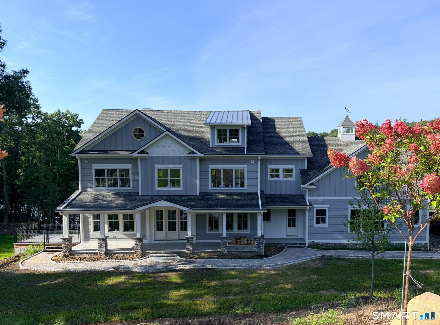 LAKEFRONT LUXURY. NEARLY COMPLETE. Your Lake Lillinonah dream is almost here. Set directly on the water, this extraordinary new residence offers a rare opportunity to own a brand-new architectural showpiece in one of the lake's most coveted settings. Designed for elevated entertaining and effortless everyday living, the dramatic two-story living room flows seamlessly into the kitchen and formal dining room, all framed by beautiful lake views. Five en suite bedrooms-with room for a sixth-are complemented by two private offices, a play/hang-out space, and a family room. The lower level takes lake living to another level, featuring a game room and impressive great room with gas fireplace and fabulous bar, plus a dedicated changing room and shower room for effortless transitions from water to home. A separate, thoughtfully planned space is plumbed for a plunge pool, sauna, hot tub, or private wellness retreat. Every detail has been designed around gathering, relaxing, working, and enjoying the lake. A designated elevator shaft is already in place, adding convenience and future flexibility. Construction is nearing completion. Come experience the setting, envision the possibilities, and make this extraordinary Lake Lillinonah retreat your own.