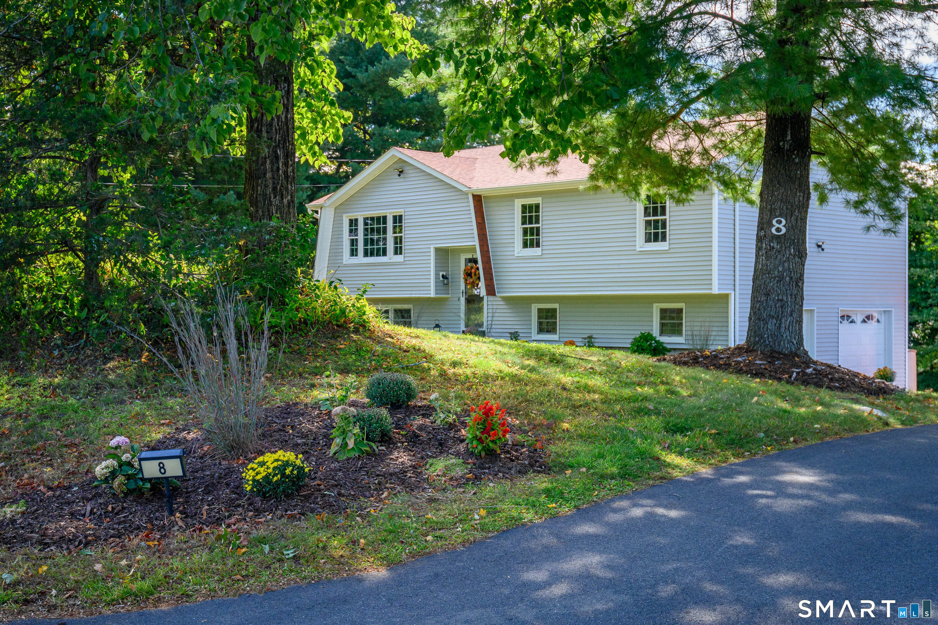 Your search is over! Location, Location,Location. Sitting pretty-this beautiful home has been lovingly maintained & cared for. Pride of ownership is evident throughout! This sprawling multi-level home is just minutes from the 39 acre MecKauer Park & all of Bethel's finest shopping/restaurants & easy commuting roads. This home offers approx 2200+ sqft with 3 Bdrms/2.5Bths on lovely grounds. From the moment you arrive, find a newly paved driveway entrance, new walkway, stone walls, new siding, newer roof, a remodeled kitchen w granite counters is an epicureans delight w updated cabinets & newer SS appliances. The guest Bth has a newer tub & tiling. Windows have been updated & tilt in for easy cleaning, hardwd flrs have been refinished, modern lighting & fixtures can be found throughout the home adding style. Adding additional living space is the Family Rm perfect for relaxing with new vinyl flooring & electric fireplace leading to the lovely outdoors. Step beyond the kitchen & enjoy the sun drenched deck with retractable awning overlooking the fabulous backyard. The interior rooms & deck have been freshly painted. Newer washer/dryer & outdoor sensors are a plus. The front yard offers privacy yet room to play. Lovely garden beds & fresh mulch add crispness & pops of color. Living in Bethel is a breath of fresh air offering country living with every convenience. A vibrant downtown offers sidewalks, restaurants, cafes, a convenient library, Metro North & a school system located in