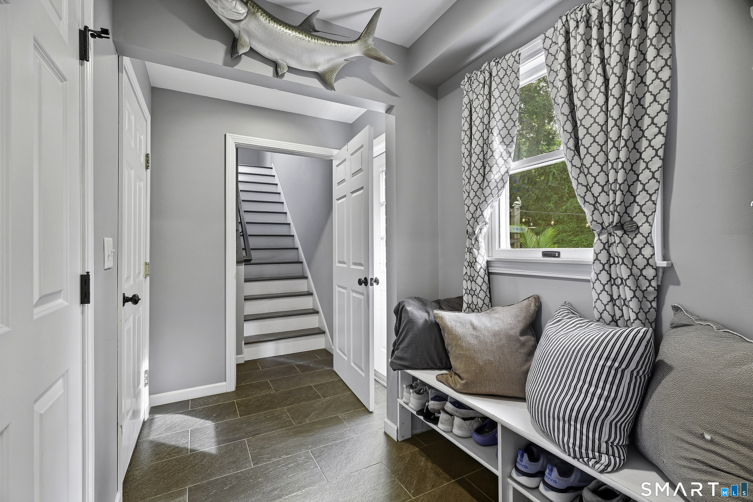 Mudroom leading to in-law/guest suite- Rear door and garage access