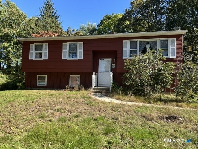 Solid raised ranch with hardwood floors in living room, bedrooms. Large living space in lower level with woodstove, workshop and walkout. Paved driveway, shed, large level lot. Needs updates, most likely for an investor. Deck needs repair, cash or conventional. Easy commute to 395
