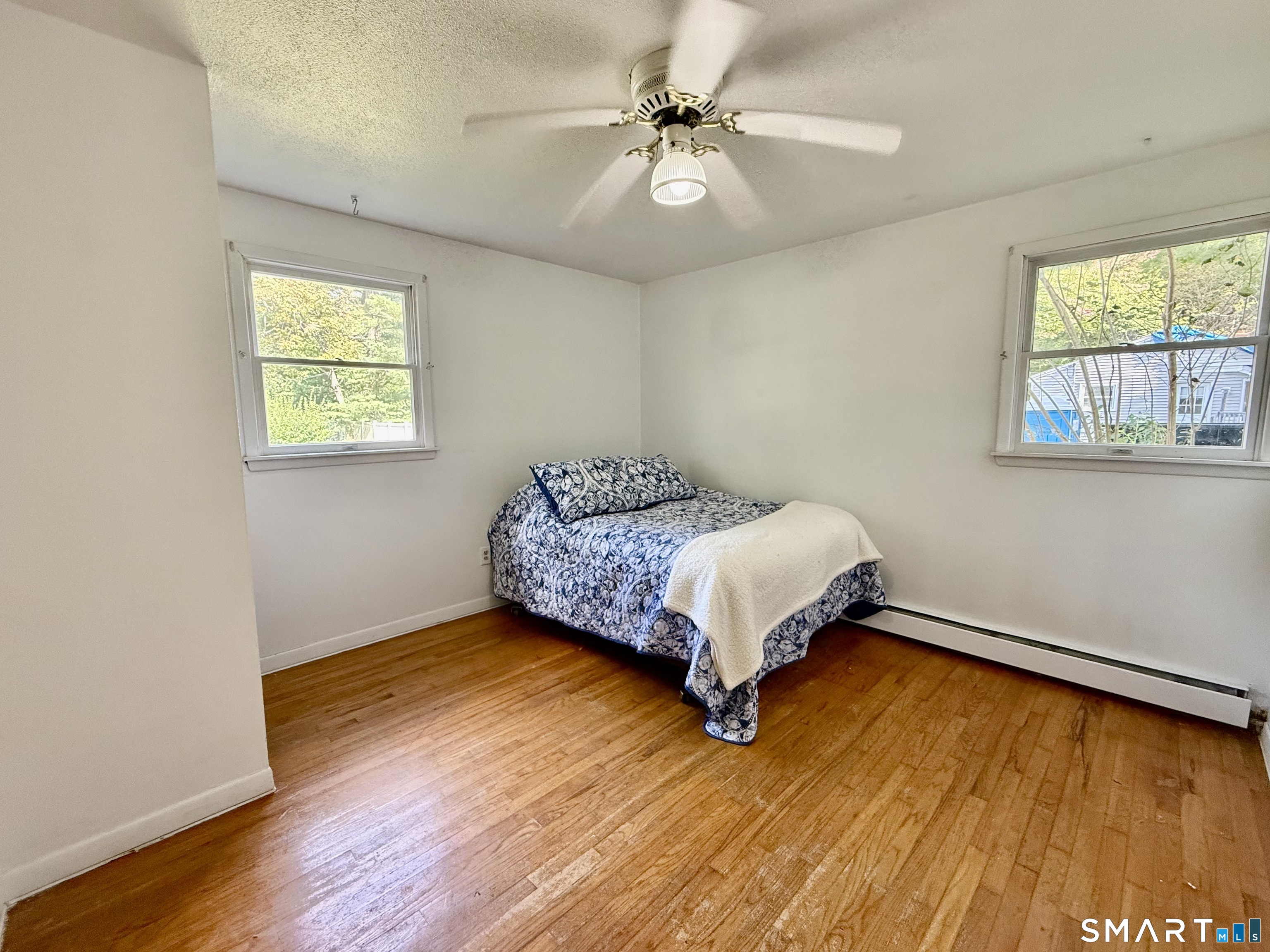Bedroom with solid wood floors.