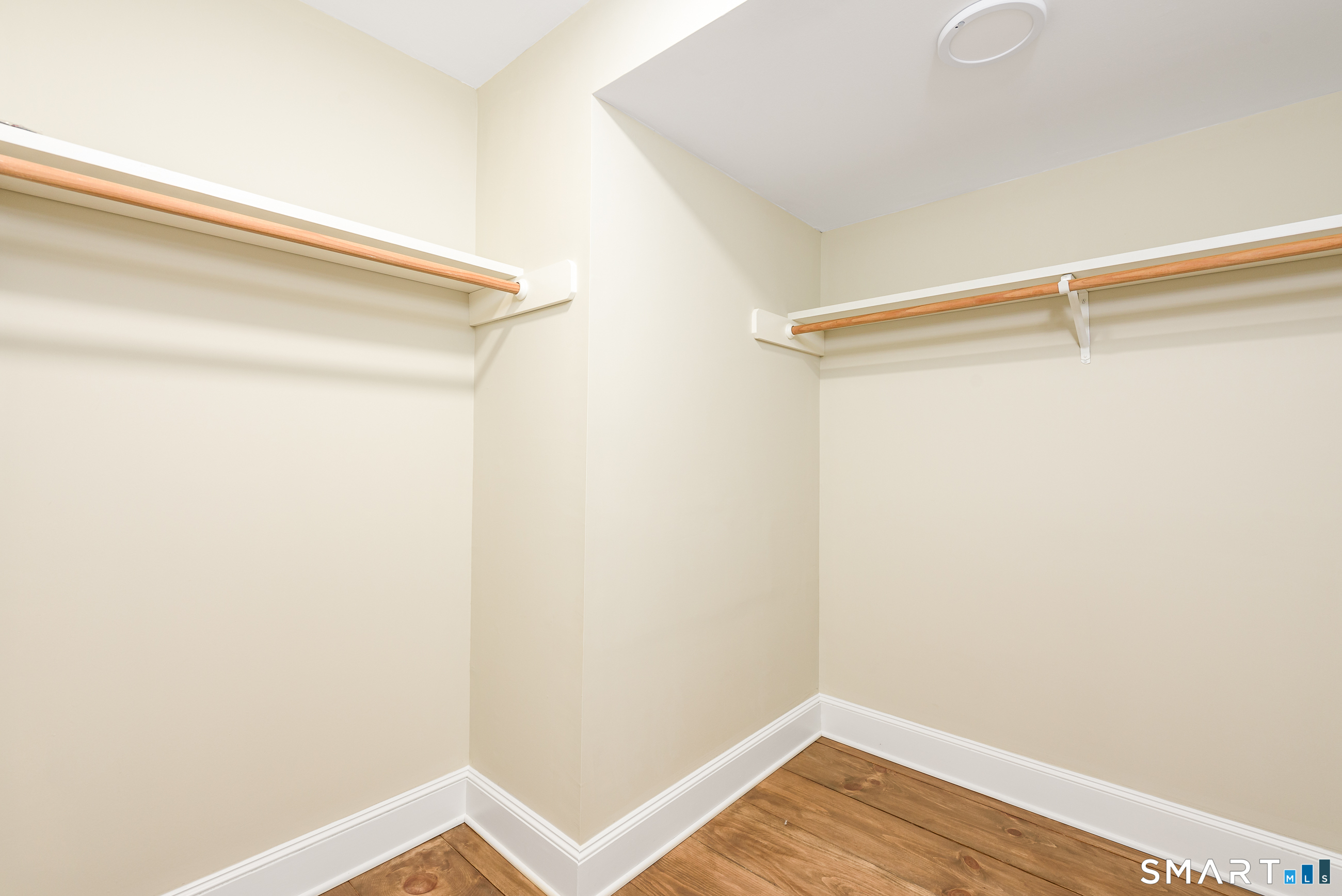 one of two walk in closets in the primary bedrooom
