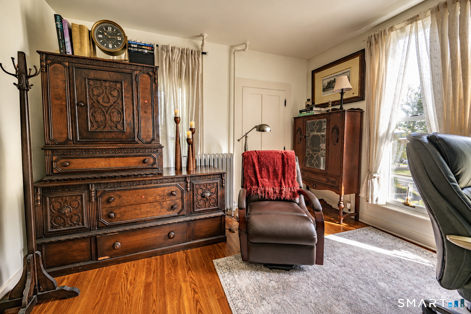 Once part of Dr. Markham's original office, this flexible first-floor room is ideal for a home office, sitting room or creative space, with easy access to the second kitchen and adjoining sunroom.