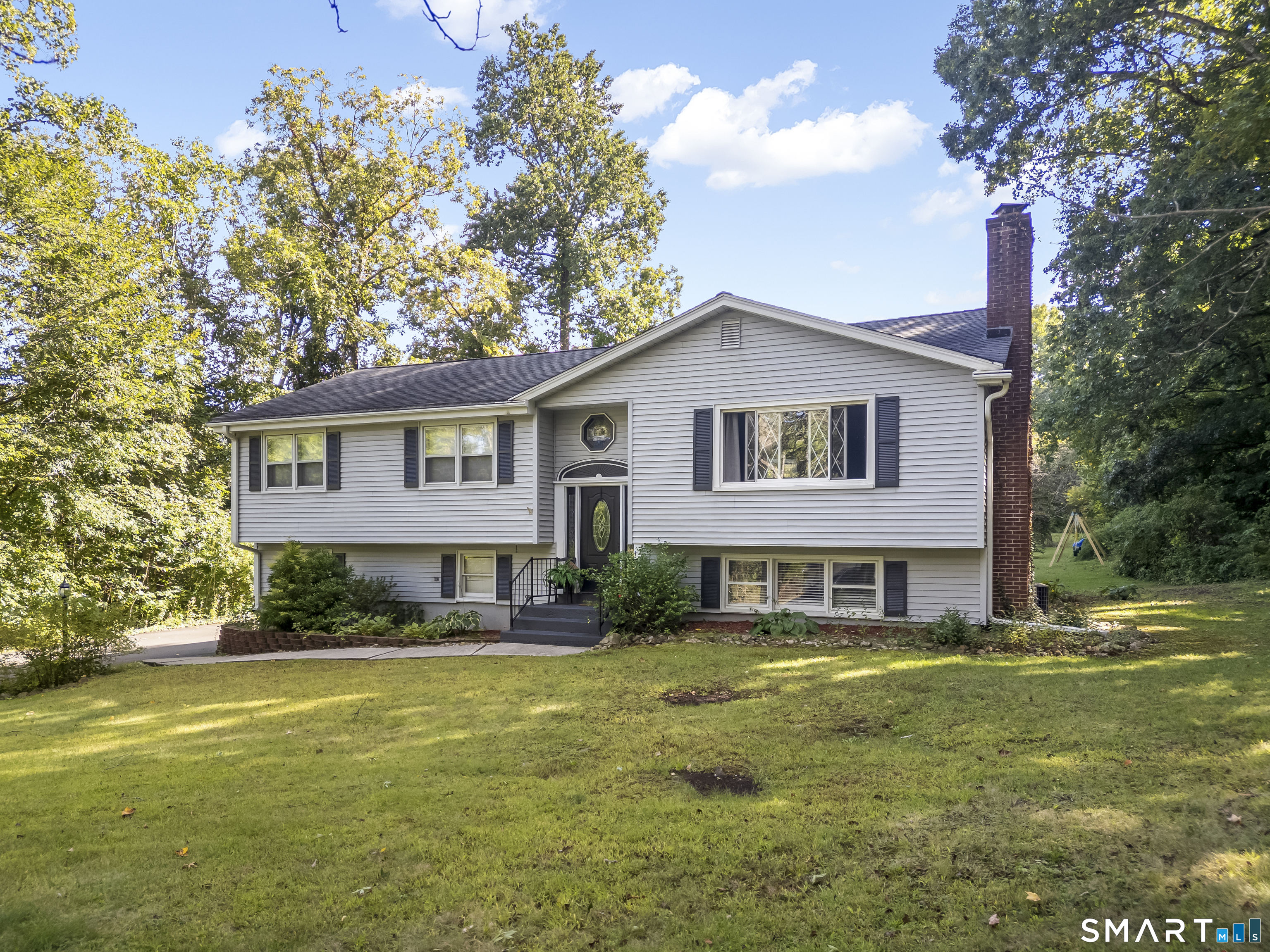 Welcome to this beautifully renovated 3-bedroom, 2.5-bath raised ranch nestled on a quiet cul-de-sac. Set on 1.58 acres, this home features an inviting open-concept living, dining, and kitchen area, with a bright solarium leading to a Trex deck and spacious backyard, perfect for entertaining. The upper level offers a full bath, three bedrooms, including a primary bedroom with a private half bath. The lower level provides a second living area, full bath, laundry, and garage access. Conveniently located minutes from shopping, schools, and highway access, this home offers the perfect blend of space, updates, privacy, and convenience.    SOLD AS-IS!  Showings start Tuesday 9/29!