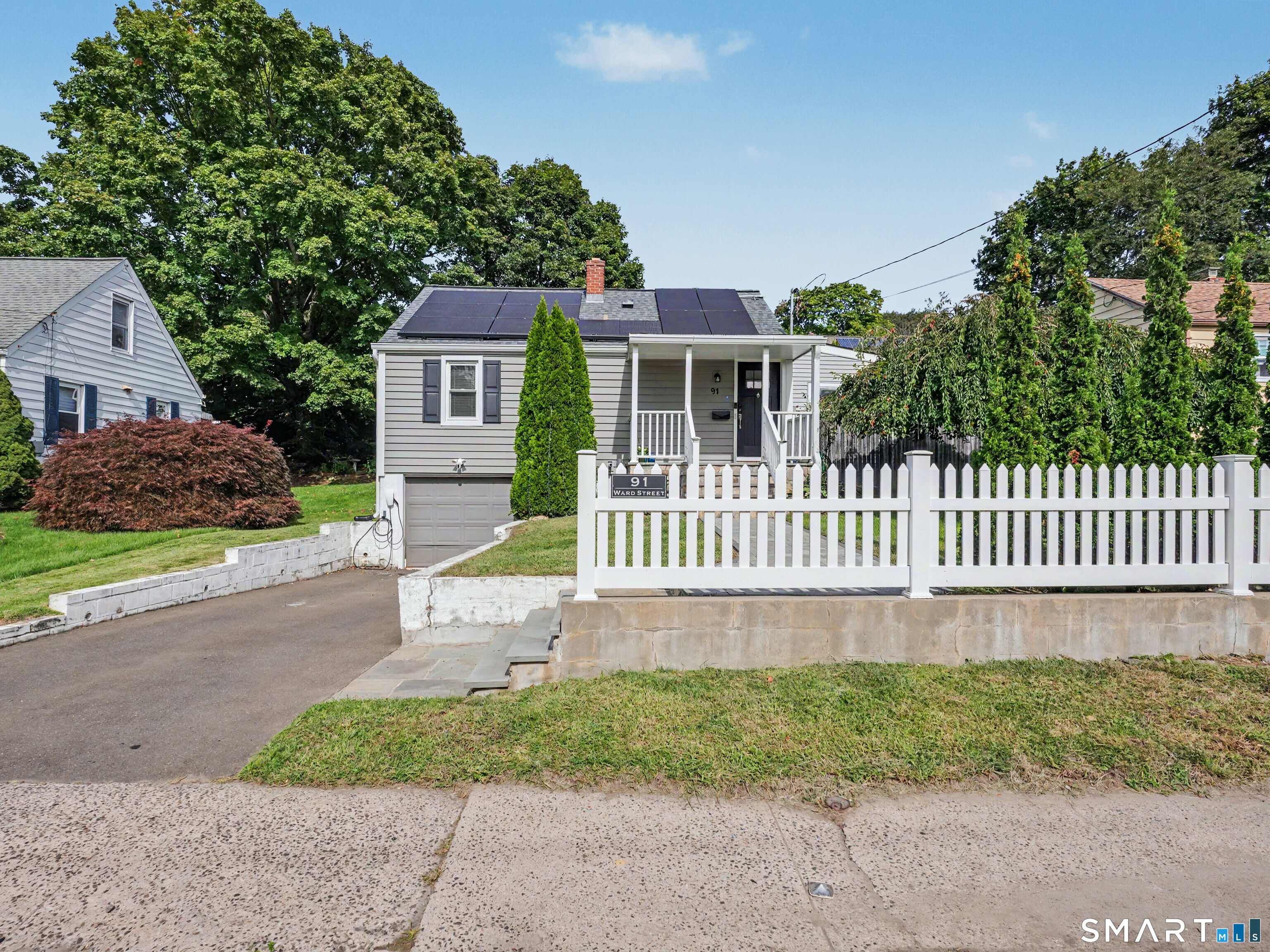 Beautifully expanded and thoughtfully renovated Cape offering a wonderful blend of classic charm and modern updates. This inviting 4 bedroom, 2 full bath home features a flexible floor plan with comfortable living spaces and plenty of room to grow. A versatile den/office opens through sliders to a large deck overlooking the landscaped fully fenced yard, perfect for entertaining, relaxing, or enjoying outdoor living. The outdoor space includes a patio and pergola, creating an ideal setting for gatherings or quiet afternoons. The fully finished attic provides valuable additional living space, while the under-house garage offers convenient parking and storage. Numerous updates throughout make this home truly move-in ready. A terrific opportunity to enjoy an expanded Cape with character, functionality, and exceptional outdoor space in a desirable Norwalk location.