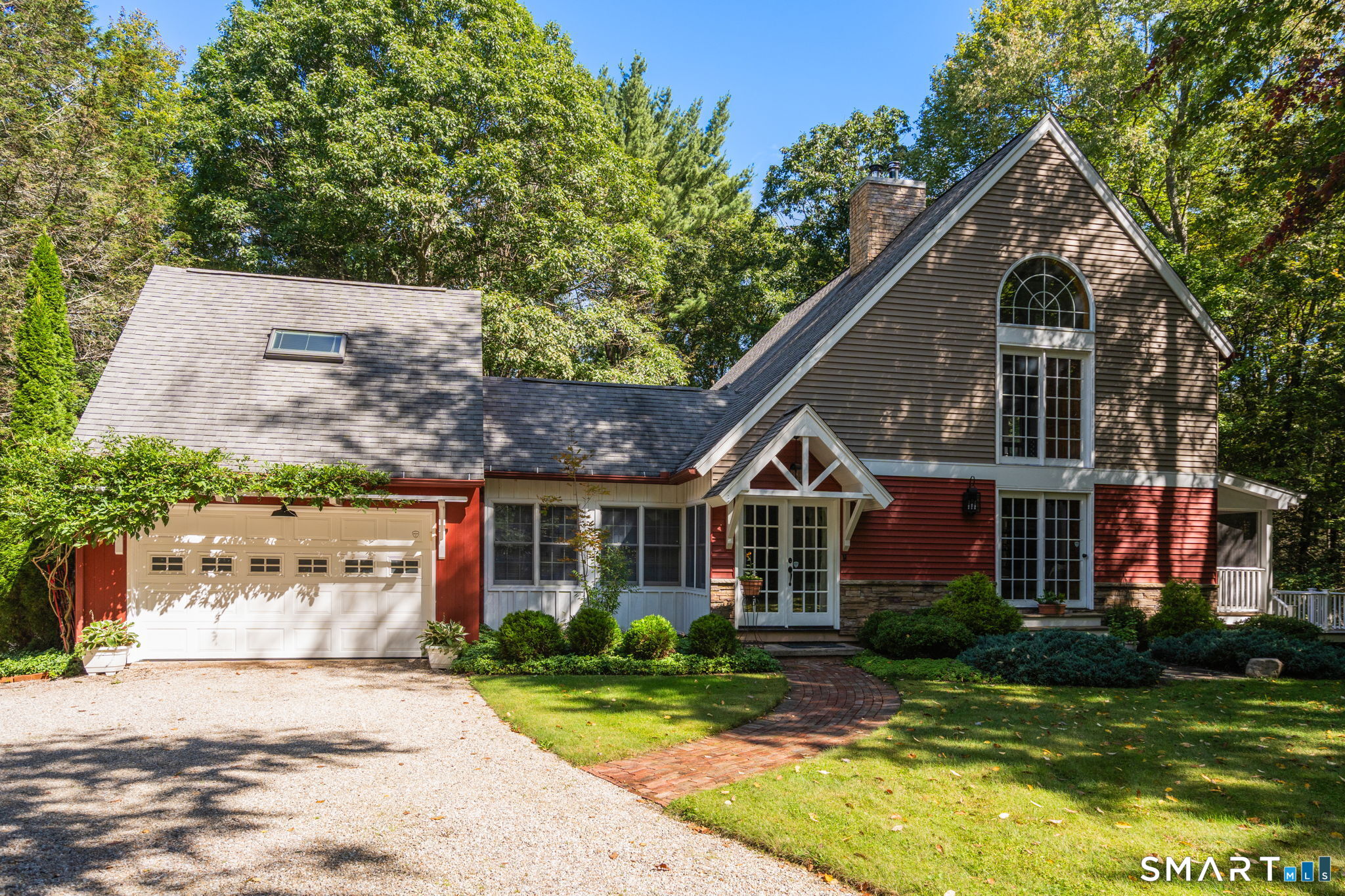 Introducing 207 Old Forge Road: The perfect blend of a nature-lover's paradise and a modern oasis set on four acres. This home is a true modern-classic, with a mix of elevated finishes and rustic accents. Enter through the front door into the light and bright mudroom, large enough for a sitting area overlooking the rear gardens. Head up the stairs to find the favorite bedroom in this home, a lofty space with four skylights and light wood floors, currently utilized as an office. Take the stairs down to the main living space, where you'll find soaring ceilings and floor to ceiling windows in the living room, light shining off the incredible white-washed floors. Large exposed beams guide you into the dining room and the breathtaking kitchen, where abundant counter and cabinet space are complimented by a massive island with a prep sink, seating, and more storage. Upstairs, find a bonus loft, born for a reading nook or home office. Continue down the hall for two bedrooms, plus a massive and thoughtful bathroom with a soaking tub under a skylight, along with a shower and updated vanity. This elevated home has even more to offer downstairs, with a laundry room, plentiful storage and immaculately finished basement, offering natural light from full sized windows, and a warm cozy wood stove.