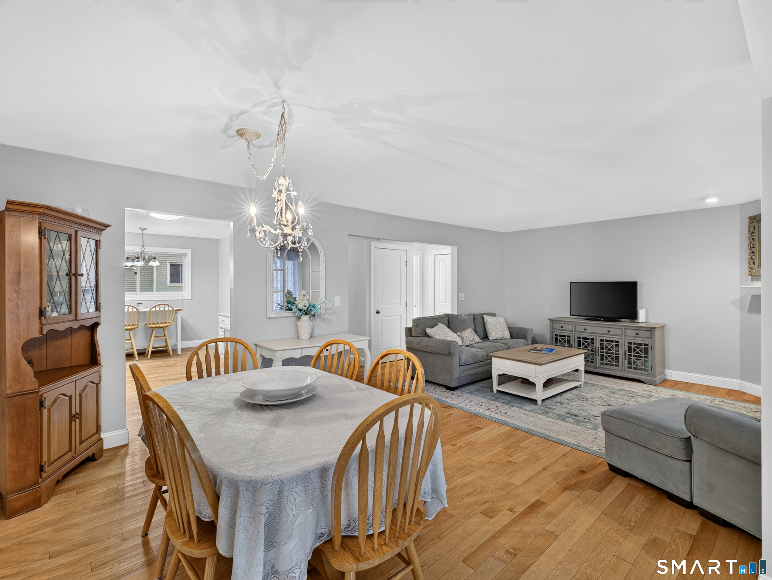 GREAT FLEXIBILITY HERE-DINING AREA OPENS TO LIVING ROOM FOR LARGER GATHERINGS