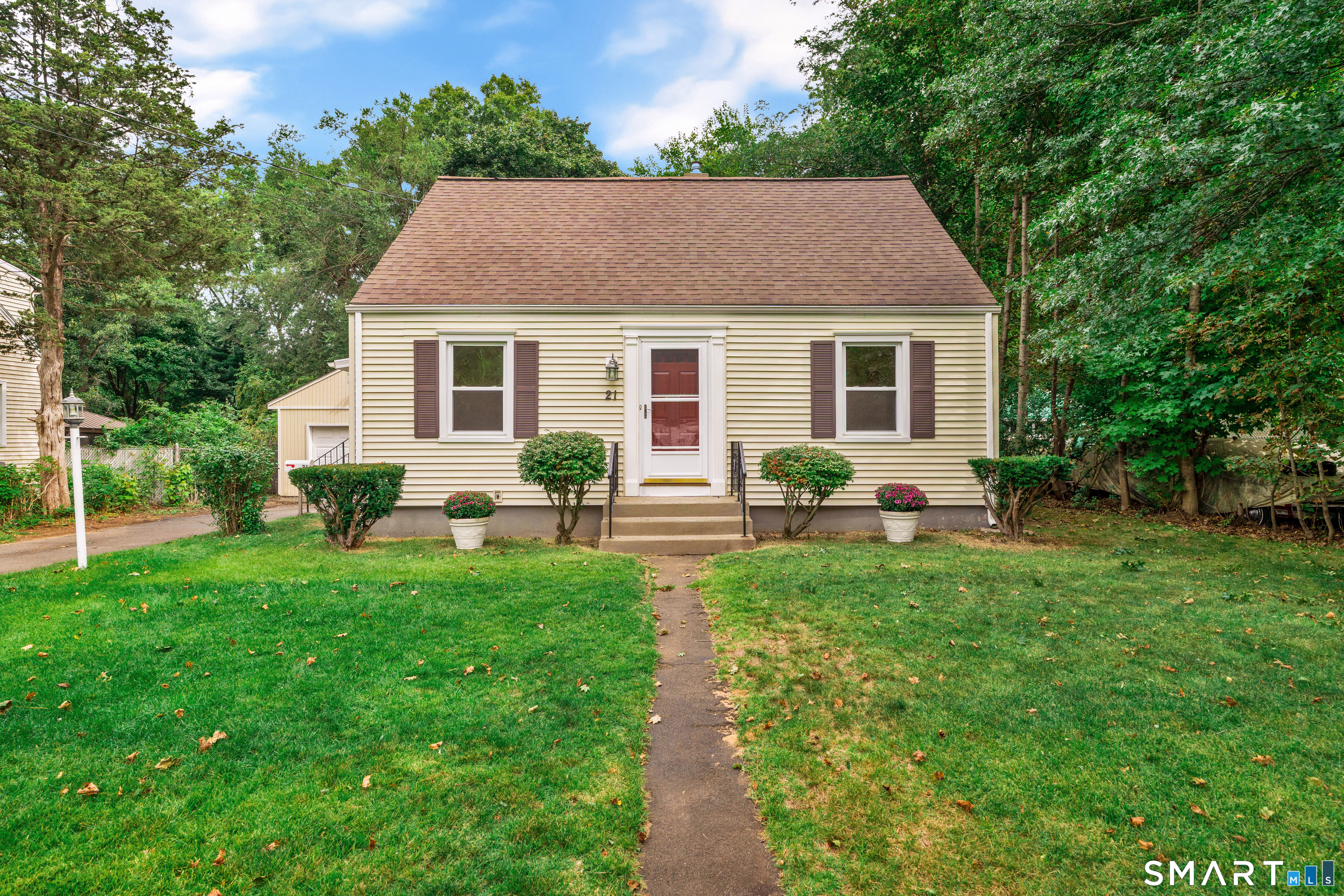 Stunningly cared for and truly move-in ready, this meticulously maintained 4-bedroom, 2-full-bath cape cod style home offers exceptional versatility. The welcoming living room features gleaming hardwood floors, while the eat-in kitchen offers solid wood cabinetry and comfortable space for everyday dining. A charming mudroom/porch area provides an inviting entry and place to drop your shoes. The main level is completed by two bedrooms and a full bath. Upstairs, two additional bedrooms and a second full bath provide flexibility for family or guests. The clean, well-maintained basement offers excellent additional space for a home gym, hobbies, storage, or potential future expansion. Outside, enjoy a level, fenced backyard with an impressive 350+ sq. ft. concrete patio, perfect for outdoor entertaining and relaxing. An oversized detached one-car garage provides abundant storage space and workshop area. Recent improvements include a brand-new TRANE HVAC system with central air and natural gas heat, professionally cleaned ductwork, refinished hardwood floors, and fresh paint throughout. Pride of ownership is evident throughout this exceptionally clean and pristine home. Ideally located in North Haven with convenient access to major shopping, highways and everyday amenities, this turn-key home is ready for its next owner.