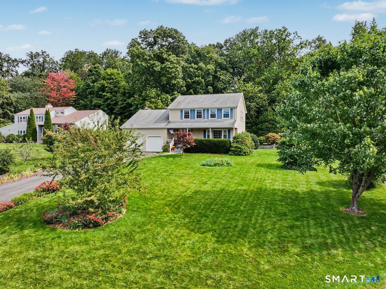 Welcome to 131 Hillside Lane, a beautifully appointed 3-bedroom, 2.5-bath Colonial in Monroe's desirable Whitney Farms Golf Course community. Set on a .51-acre lot with approximately 1,906 square feet, this inviting home blends classic Colonial charm with tasteful updates and numerous improvements.  The main level offers a comfortable flow for everyday living and entertaining, while three well-proportioned bedrooms upstairs include a spacious primary suite with private full bath. An additional full bath and convenient main-level half bath provide flexibility for family and guests. Bathrooms were tastefully updated in 2022 and 2025, and the kitchen features stainless steel appliances, including a newer refrigerator/freezer and microwave.  Major improvements include Harvey windows, updated siding, a rebuilt chimney completed in 2026, and a refreshed deck with a new surface and select supports replaced in 2025. The roof is backed by a 50-year transferable warranty, offering added peace of mind. The home also features gas heat, a tankless gas water heater, and full-size laundry.  Enjoy the peaceful residential setting of Whitney Farms, with the golf course just minutes away and convenient access to Monroe's schools, shopping, dining, parks, and everyday amenities. The spacious .51-acre property offers plenty of room to relax, garden, play, or entertain. A wonderful opportunity to enjoy a well-maintained Colonial in an established Monroe community.