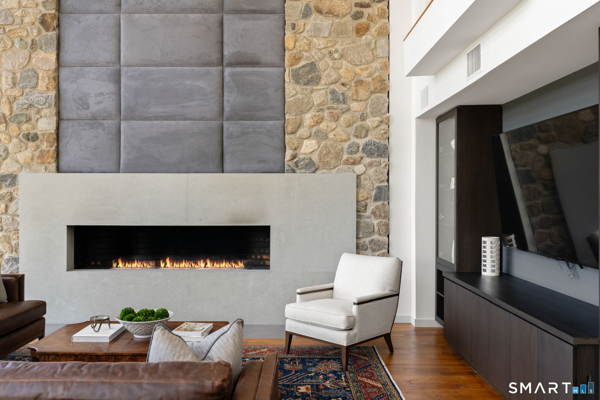 18 Ft natural stone fireplace anchors the living room