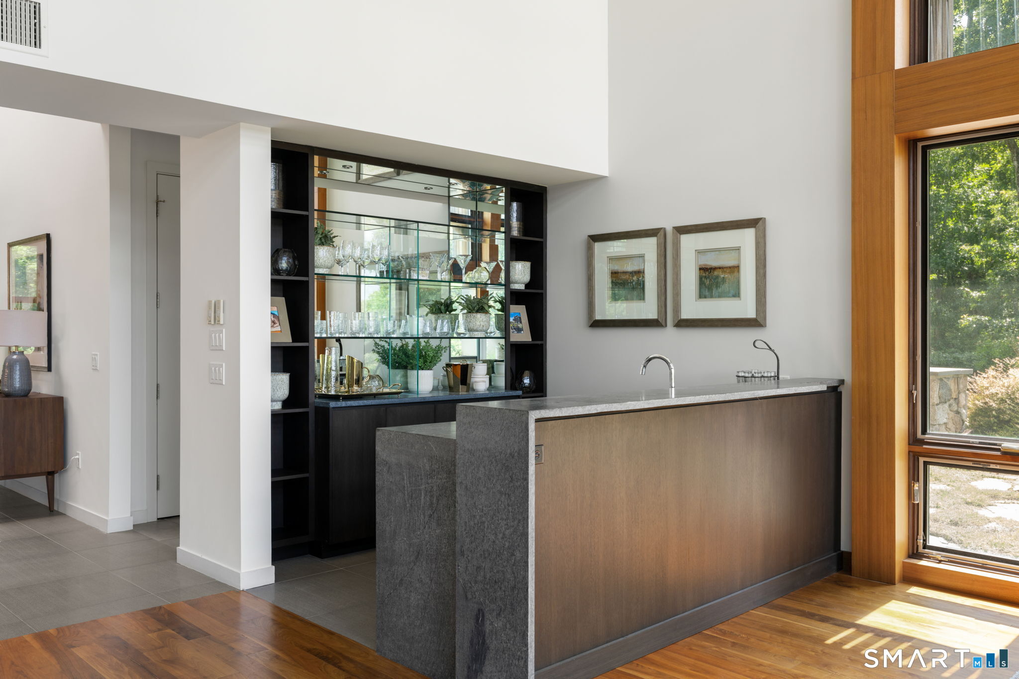 Soapstone waterfall wet bar for effortless entertaining