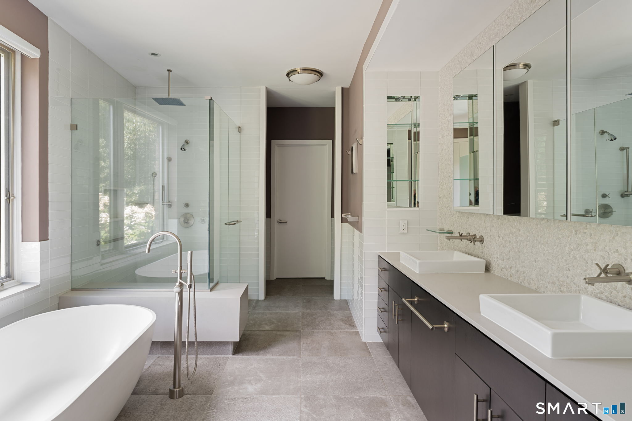 Primary bathroom; double vanity, glass shower, and freestanding soak tub