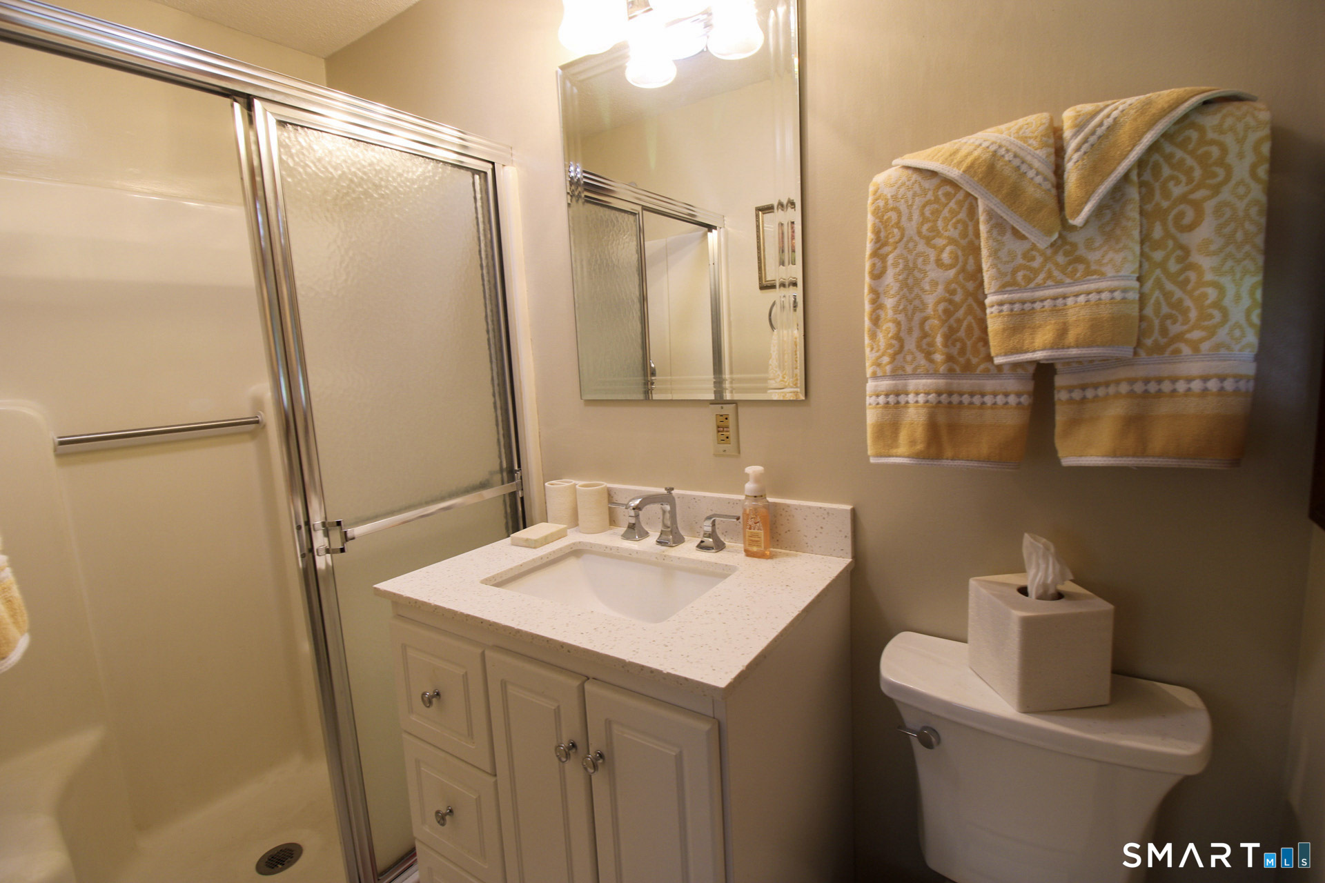 Primary bedroom full bathroom with stall shower