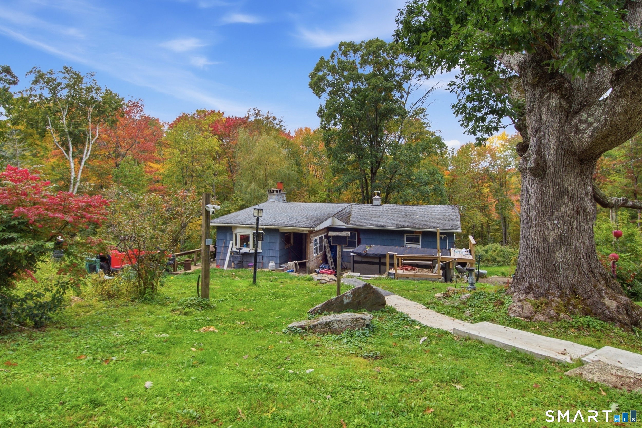 Over 15 acres of private land in Warren, with the potential to create an additional building lot(s)! The parcel offers frontage on Brick School Road, open lawn shaded by mature trees, and acres of woods, ideal for a future homesite, gardens, recreation, or simply enjoying total privacy in the Litchfield County countryside. The property includes a single-level 1960 ranch with 3 bedrooms, 1 full bath, 1,160 sq ft of living space, a fireplace, a deck, and a front porch, plus a 1,040 sq ft unfinished basement. Systems are functional, including a 12-year-old roof, a 5-year-old water heater, a 4-year-old well, and a septic system pumped in July 2026. The home needs some cosmetic updating, making it a great opportunity to build sweat equity while you plan for the land. Opportunities like this are rare in Warren, so don't miss it!