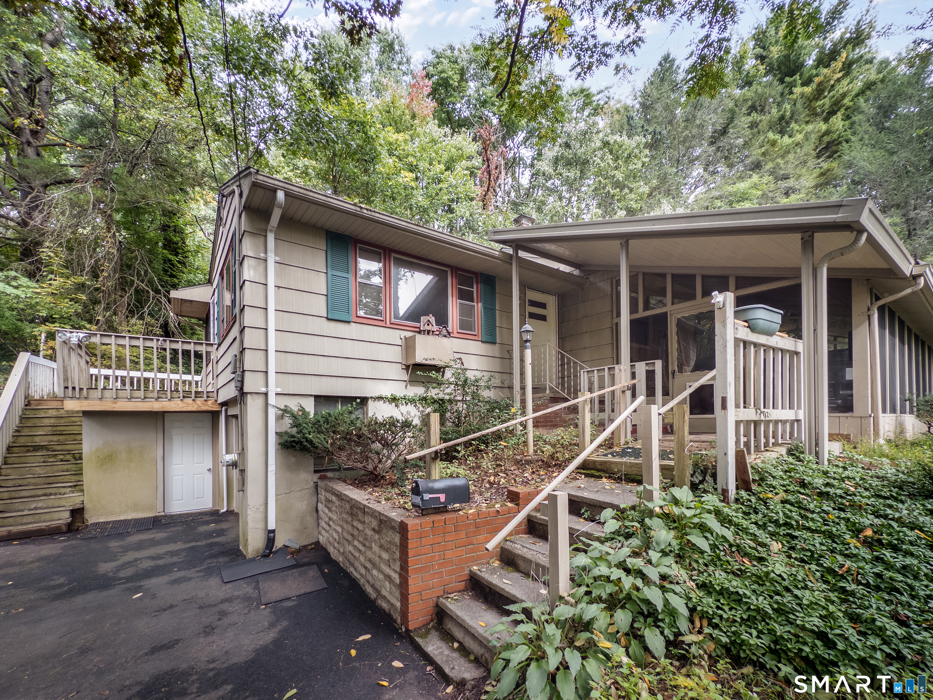 OPEN HOUSE SUNDAY 10/4 from 11:30-1:30pm Bring your vision and unlock the potential! Whether you're a first-time buyer looking for an affordable opportunity to build equity or an investor searching for your next project, this 3-bedroom, 1-bath home offers a great opportunity. Privately set on a .49-acre lot perched above the road, the property offers a peaceful setting while still providing convenient access to all that Hamden has to offer! Shopping, dining, schools, hiking and everyday conveniences. Inside, you'll find hardwood floors that can be refinished, along with a large 3 season family room addition 12x28 that provides additional space for entertaining or enjoying the private surroundings. A one + car garage adds convenience and storage. Downstairs also has the potential to finish a large room that can be a potential office space, family room, etc. 15x18. Several of the big-ticket items have already been addressed in recent years, including the furnace, roof, driveway, generator hookup and electrical service. The home is ready for updating and offers plenty of potential to renovate, customize, and add value. Shared driveway. Enjoy the best of both worlds-a private, elevated setting with convenient access to the surrounding community. A great opportunity for buyers willing to put in the work and create something special! Subject to Probate Court Approval. Please do not drive up driveway without an appointment. Being Sold AS-IS