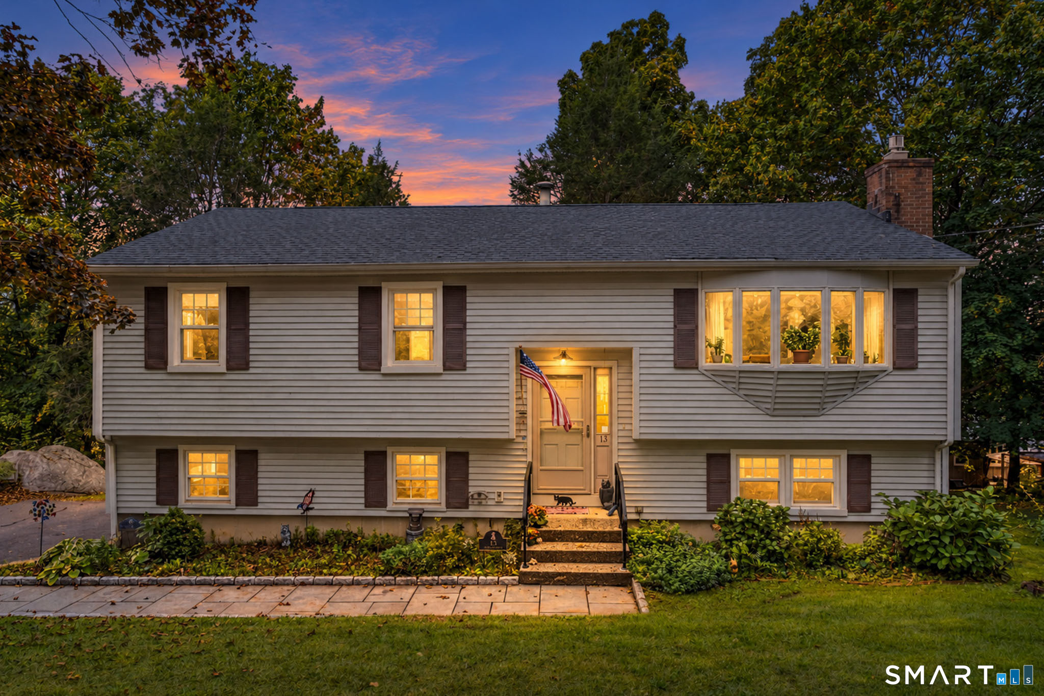 Welcome to 13 Ken Oaks Drive! A beautiful new bluestone walkway welcomes you to this three-bedroom home, offering a wonderful opportunity to add your personal touches and make it your own. The dining room opens to a deck, perfect for outdoor dining, entertaining or simply relaxing while enjoying seasonal views of Lake Kenosia. The finished lower level features a cozy fireplace and half bath, providing additional space for relaxing or entertaining. An attached garage adds convenience and storage. Ideally located near shopping, dining and major commuter routes. With a little vision and updating, this home has the potential to truly shine. Don't miss this opportunity!