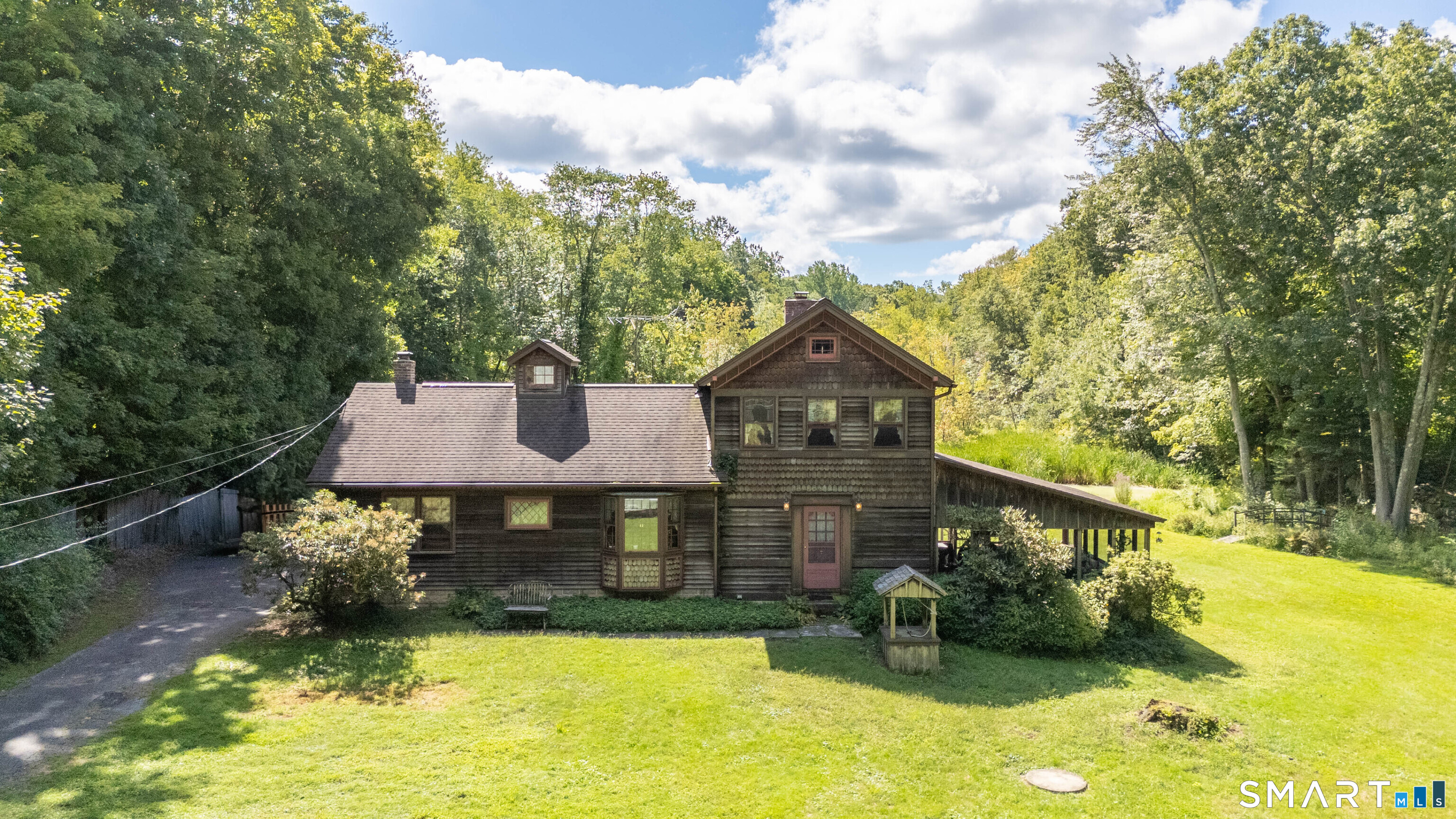 Step back to a simpler time in this charming Easton home, filled with warmth, character and plenty of potential. With its cozy and inviting feel, beautiful hardwood floors and peaceful spaces, this is the kind of home that feels familiar from the moment you walk through the door-comfortable & welcoming.  The spacious living room with fireplace opens to the formal dining room which is next to the country kitchen with breakfast area.  A large primary bedroom is on this level as well as another room which works well as a den or office.  Upstairs are 2 more bedrooms, a full bath, and a huge walk-in-attic with tons of possibility. While the home offers an opportunity for updating and personalization, it has great bones and so much potential to create something truly special. Whether you embrace its original character or bring your own fresh vision, this is an opportunity to make it your own. A huge porch area with vaulted ceiling overlooks the pretty yard which offers room to relax, play and garden. A large deck wraps around the above-ground pool for summer fun. The garden area has plenty of space for flowers or vegetables and also features a storage shed. The 2-car vaulted garage is attached with a breezeway. Set in desirable Easton, this is a wonderful opportunity for buyers looking for charm, character and a home they can love. This home has been well-loved and is ready for its next chapter!