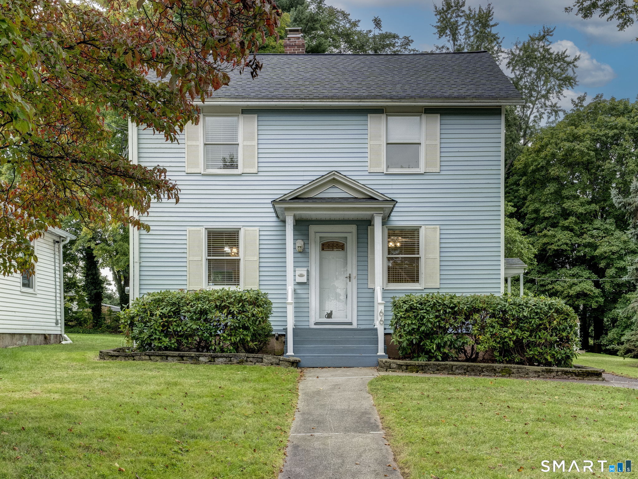 Welcome to this beautifully renovated, move-in ready colonial that blends classic architectural layout with modern, functional living space. This rare oversized lot could be subdivided. Recently updated, this gorgeous home offers plenty of room to entertain and relax.  The Main Level: Step past the inviting front porch into a bright, airy main floor of open and versatile spaces designed for gathering and comfort. A sprawling living room centers the home, flowing seamlessly into the formal dining area perfect for hosting holiday dinners and family gatherings. The kitchen offers wonderful natural light with a breakfast nook and custom floor-to-ceiling cabinets.  Sunlit Family Room: Tucked at the back of the home is a spacious family room with wood burning stove, anchored by a full bath and dedicated laundry room. Bonus Sun Room: Bathed in natural light, the attached sun room serves as a perfect home office, reading nook, or plant oasis. Outdoor Entertaining: The sun room opens up directly to a massive, custom outdoor deck, ideal for summer barbecues, outdoor lounging, and evening entertaining. The Upper Level: The primary suite provides a true sanctuary with windows that flood the room with natural light. Two additional bright bedrooms offer great closet space and share a pristine, newly updated full bath. This beautifully updated home offers ultimate peace of mind with three high-ticket upgrades: new gas furnace, new hot water heater and rooftop solar panels.
