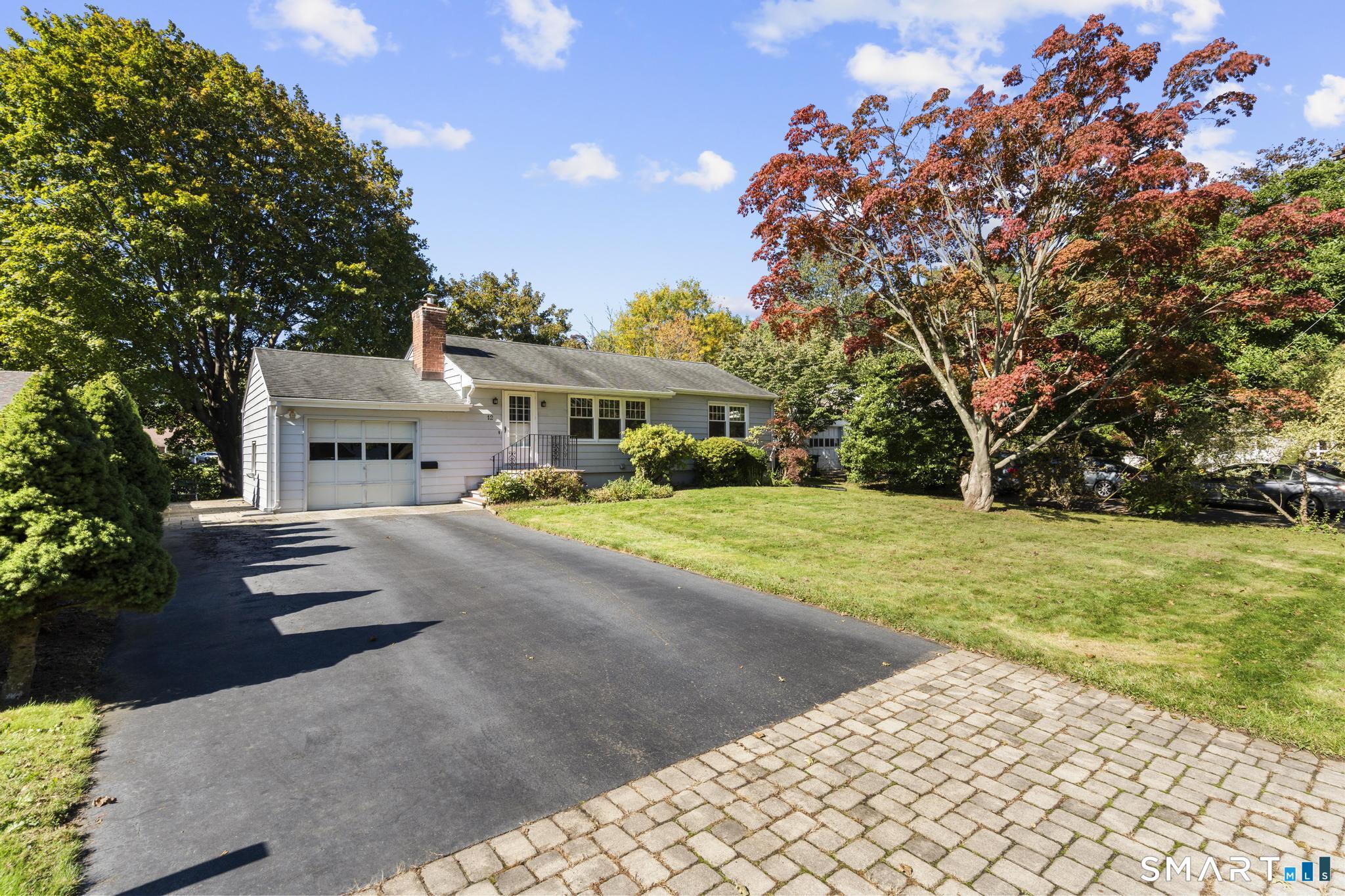LOCATION, LOCATION, LOCATION! Welcome to 12 Palmer Woods Circle, ideally situated in the heart of Branford's charming and highly sought-after town center! Enjoy the convenience of relaxing on the town green, exploring local shops, and dining at the many wonderful restaurants and cafes nearby. Offering approx. 1,100 sq. ft of comfortable, single-level living, this ranch-style home combines convenience, functionality, and a desirable location. Nestled on a quiet dead-end street, the property sits on a level, easy-to-maintain 0.22-acre lot. Inside, you'll find a spacious living room featuring a fireplace, flowing seamlessly into the eat-in kitchen. The kitchen opens to the dining area, which provides direct access to the backyard-perfect for everyday living and entertaining. The main level also features two generously sized bedrooms and a full bathroom. Additional storage is available in the pull-down attic and full basement. The private, level backyard is partially fenced and easy to maintain, offering a wonderful outdoor retreat. Additional features include city water and sewer, natural gas heating, central air conditioning, and vinyl replacement windows for added comfort and efficiency. Enjoy being just minutes from the train station, beaches, schools, downtown Branford, shopping, the library, Yale, and major highways. Branford offers the charm of a quintessential Connecticut shoreline community, with convenient access to everyday amenities and nearby destinations.
