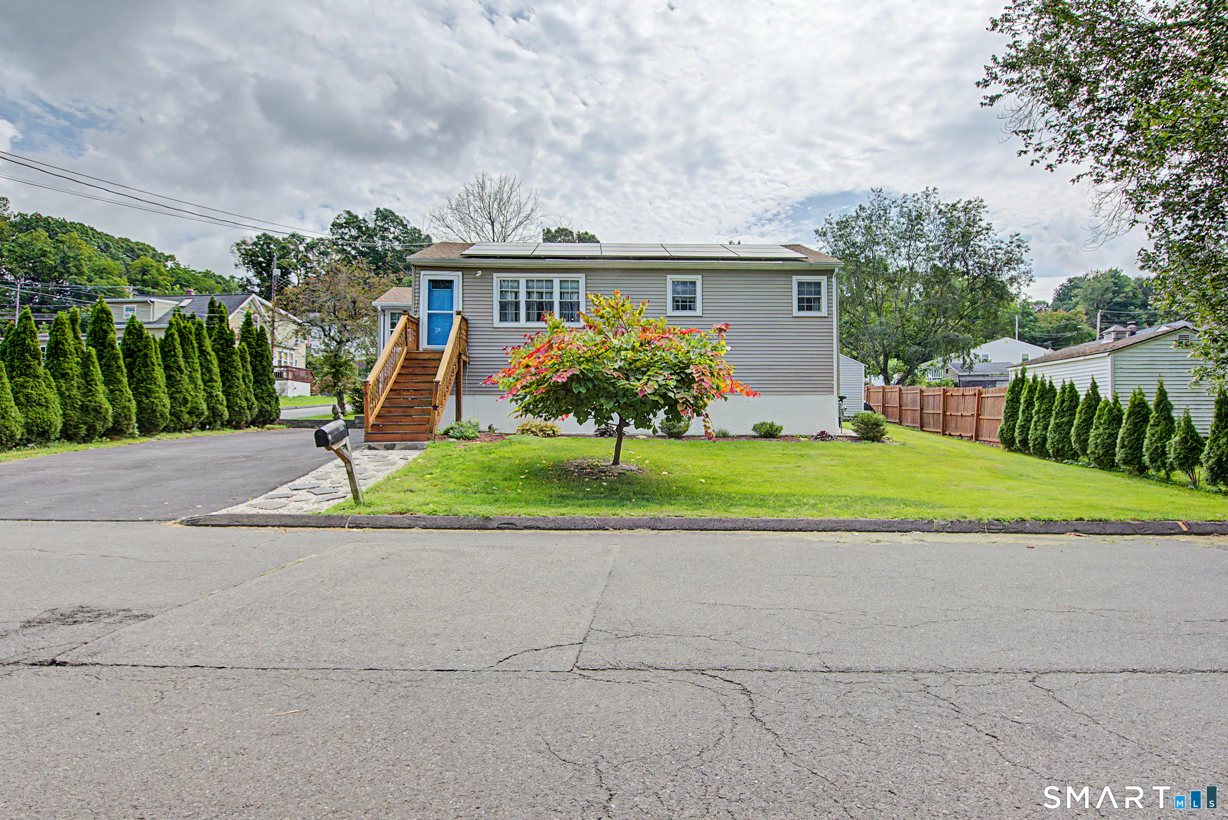 MULTI-GENERATIONAL LIVING WITH ROOM FOR EVERYONE! Welcome to 129 Gene Street, a truly unique and versatile East Haven ranch that offers the space, privacy, and flexibility today's buyers are looking for! Currently being used as an in-law setup, this 4-bedroom, 2-bath home features TWO FULL KITCHENS and multiple living spaces, making it an incredible opportunity for multi-generational living, extended family, guests, or anyone looking for added flexibility.  The main level offers an inviting eat-in kitchen, living area, two bedrooms, and a full bath, plus a spiral staircase leading to two additional bedrooms. The lower level takes flexibility to the next level with a second full kitchen, two bedrooms, and a full bath, creating a comfortable separate living area while keeping everyone close.  And the living continues outside! Relax year-round in the rustic four-season room, enjoy summer evenings on the deck, and take advantage of the private yard and corner-lot setting. A newly paved driveway provides parking for up to six cars, while solar panels add an energy-efficient bonus. The home was converted to natural gas, and the current owner has proudly maintained and updated the property throughout their 24 years of ownership.  Located on a desirable corner lot, this is a rare opportunity to own a home designed to accommodate multiple generations under one roof while still providing privacy and flexibility. Come see all the possibilities!