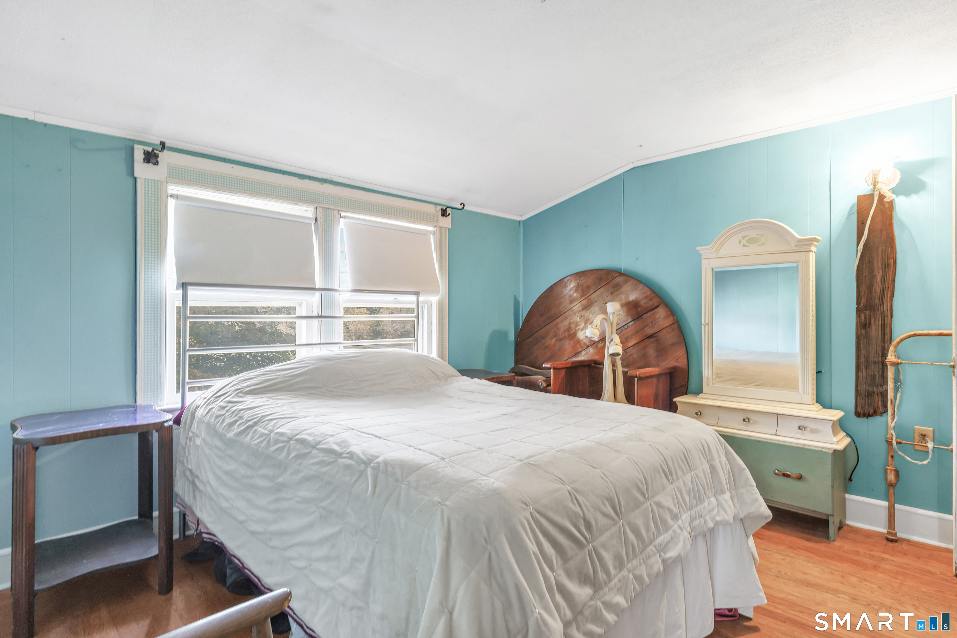 Upstairs - Primary Bedroom has a bonus room that can be used as a home office leads onto wooden deck.