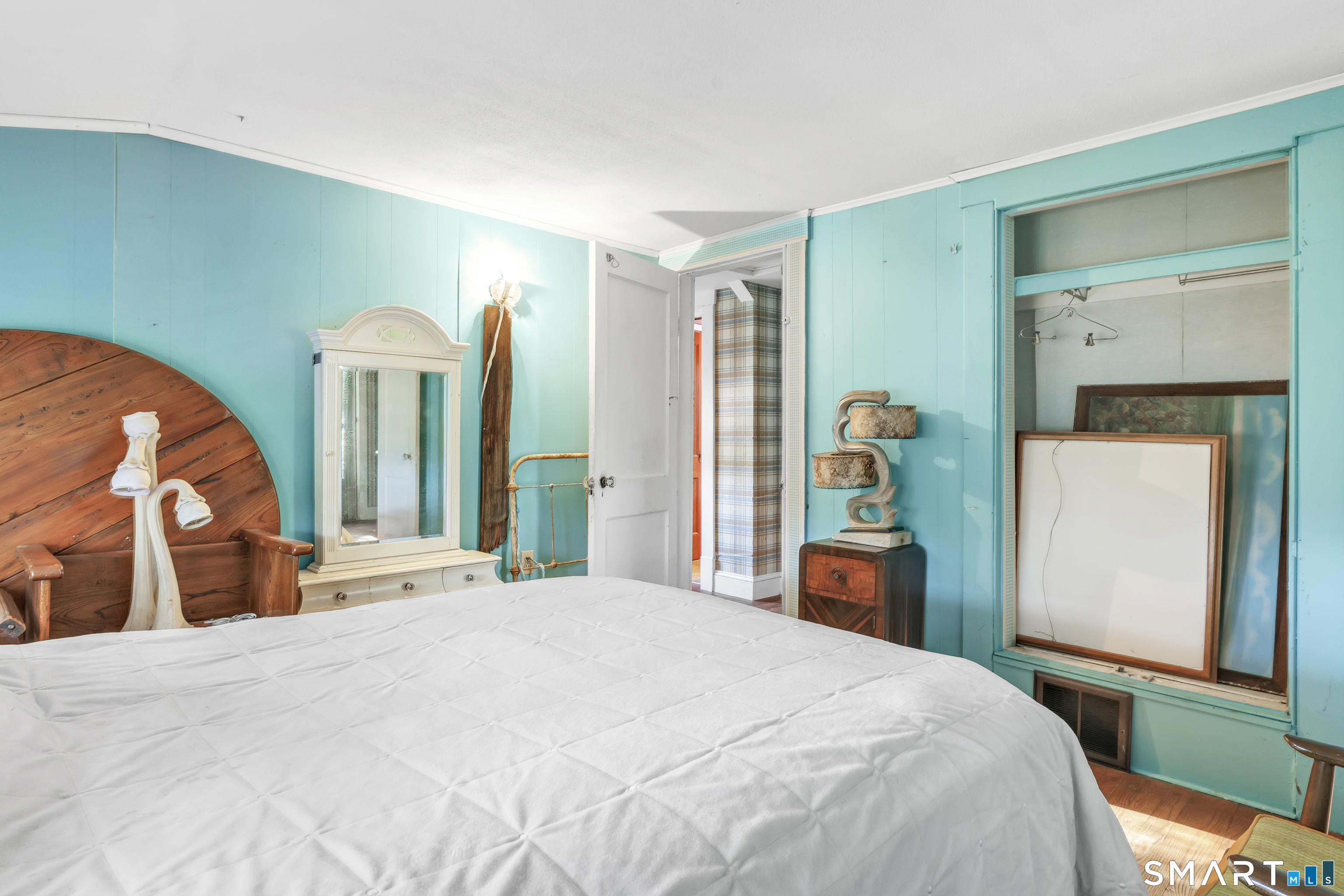 Upstairs - Primary Bedroom has a bonus room that can be used as a home office leads onto wooden deck.