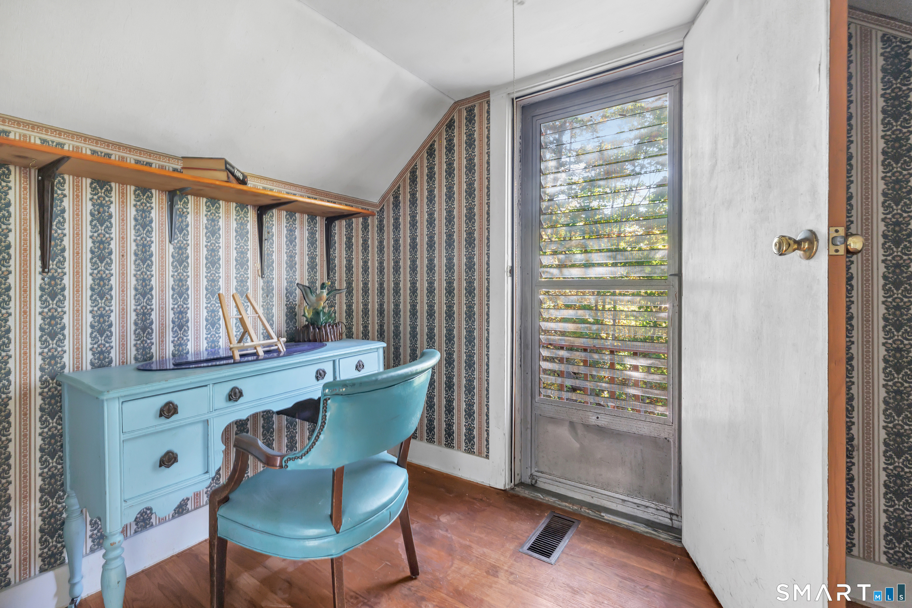Upstairs - Home Office bonus room leads out to a wooden deck from the Primary Bedroom
