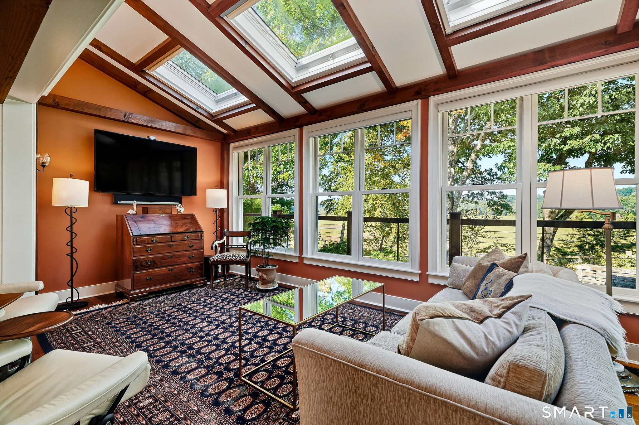 The sitting area located adjacent the kitchen - all opening to surrounding decks and hardscape