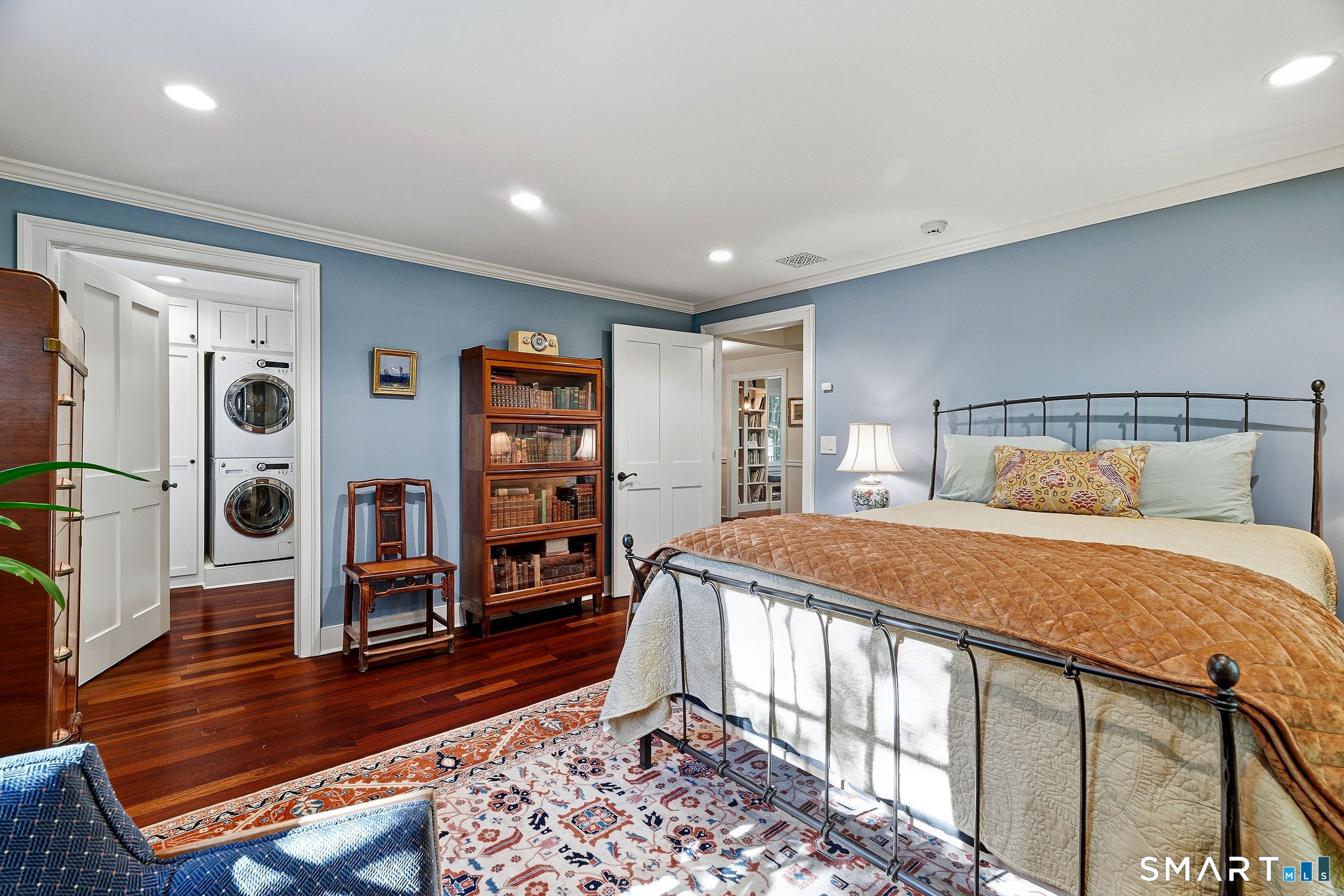 Second bedroom on the main level with walk in cedar closet, private laundry and a full bath