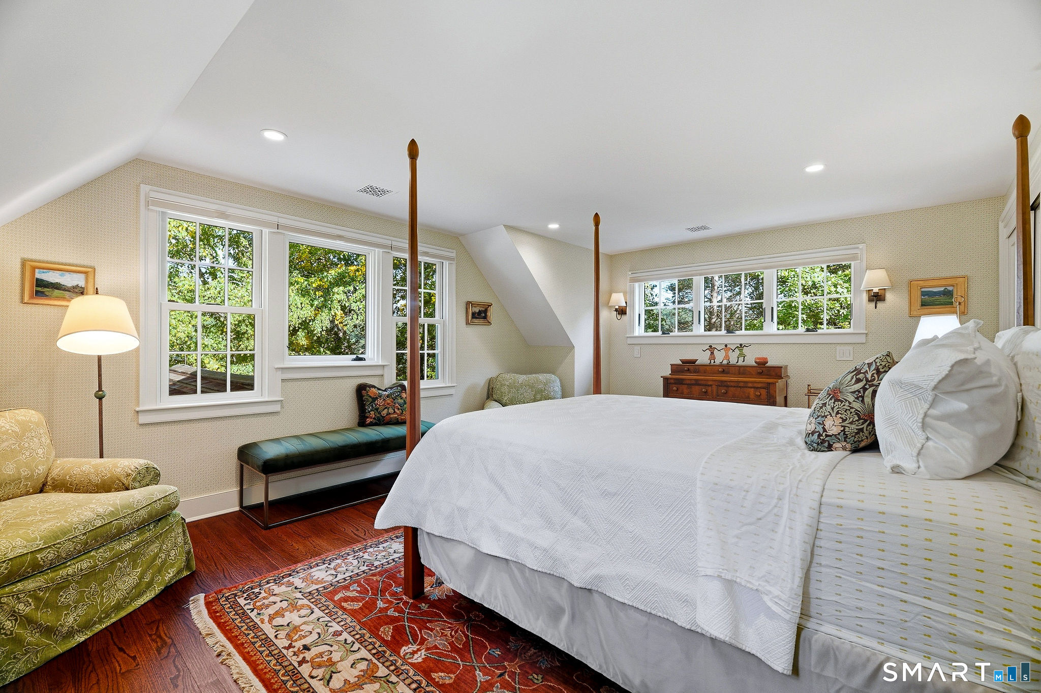 Upper level bedrooms 3 and 4 share a full bath. Attic access is found here.