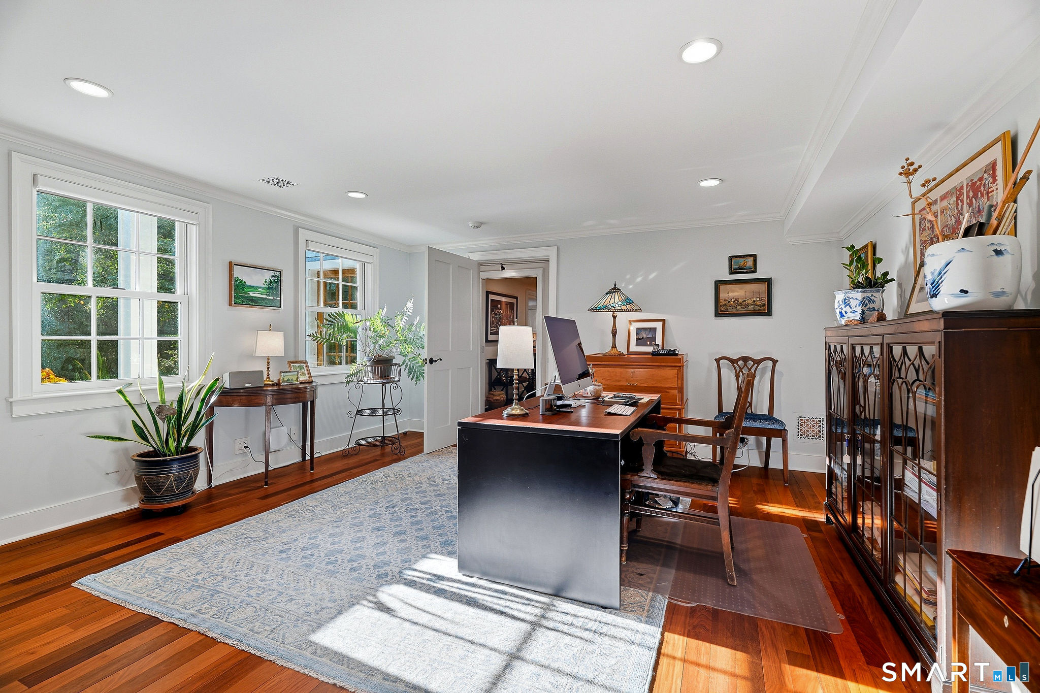 Bedroom with built in cedar closet and a wet bar with refrigeration doubles as an office, conveniently located off the entry