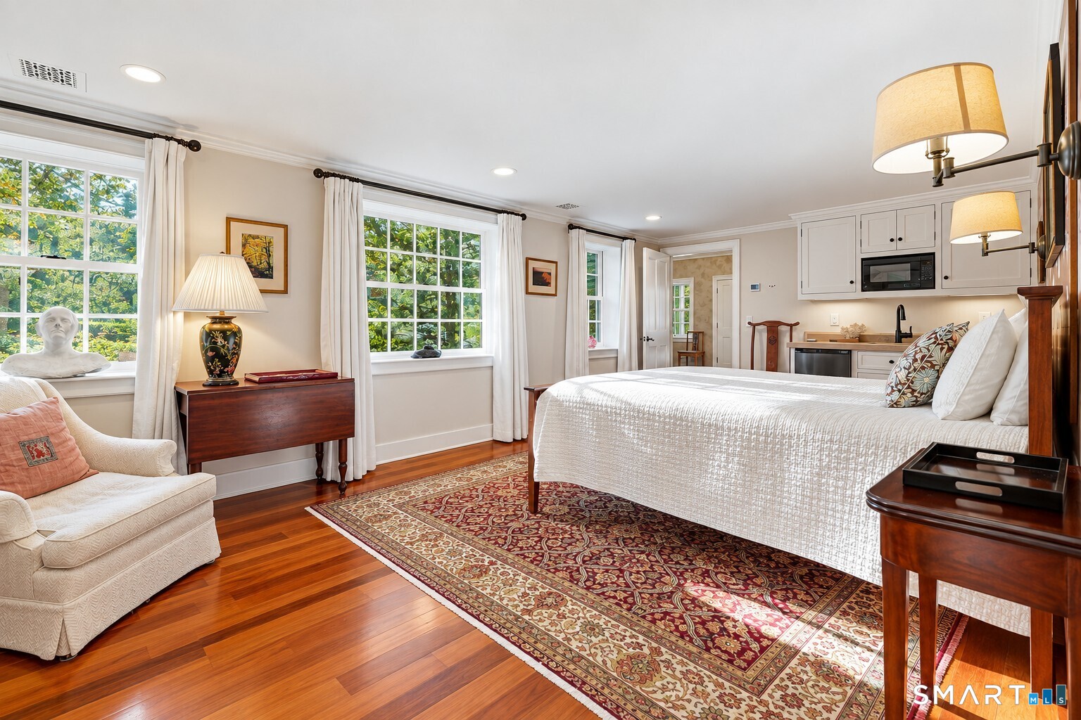This first level guest suite was created with accessibility in mind. A handsome ensuite bath and roll in shower feature Waterworks and Bain Ultra and a cedar walk in closet.