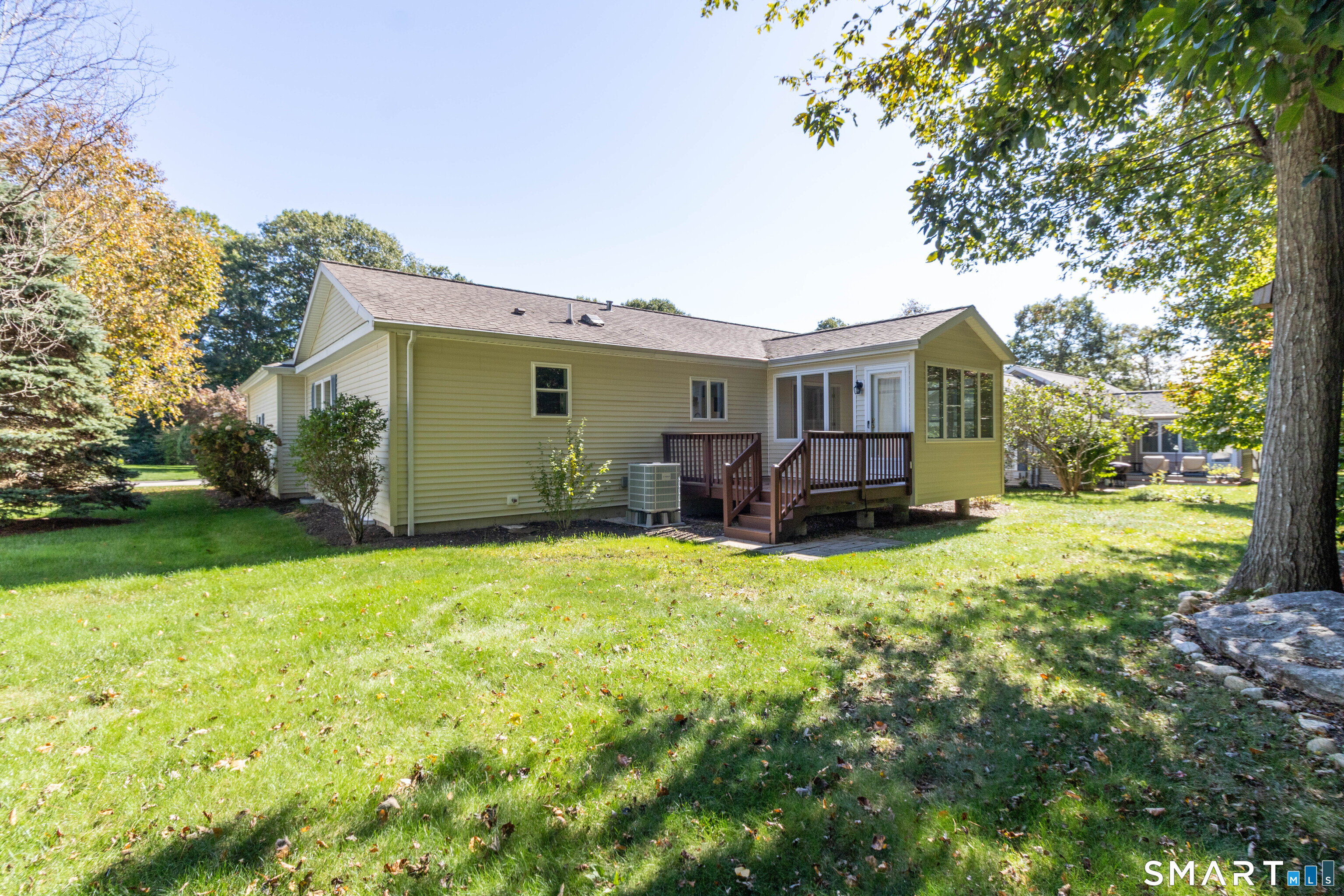 Sunroom and open deck with Trex