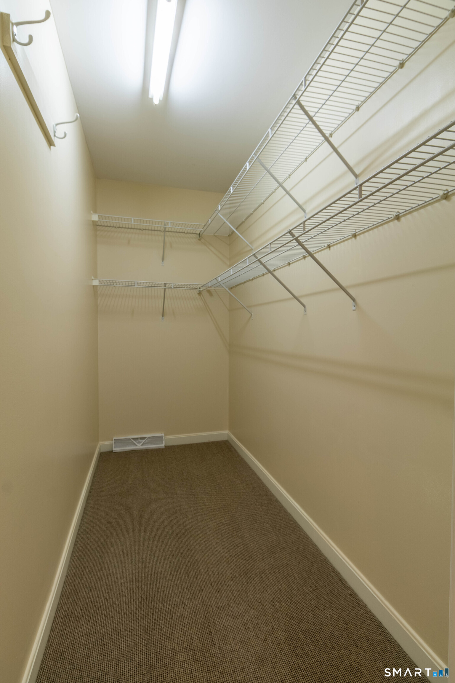 Walk in closet in primary bedroom