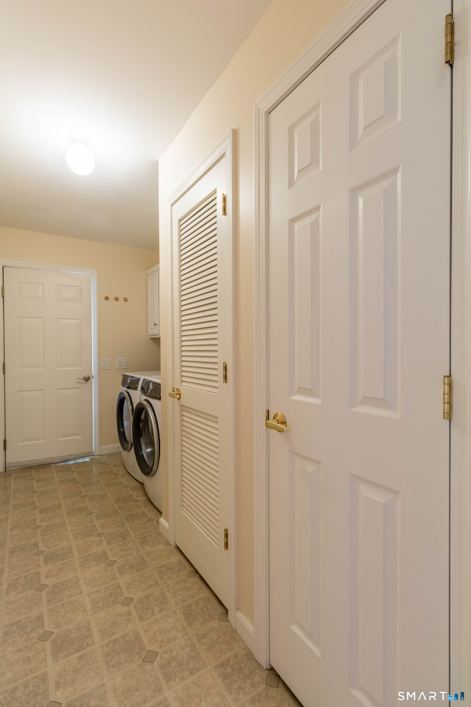 Laundry room and hallway to garage