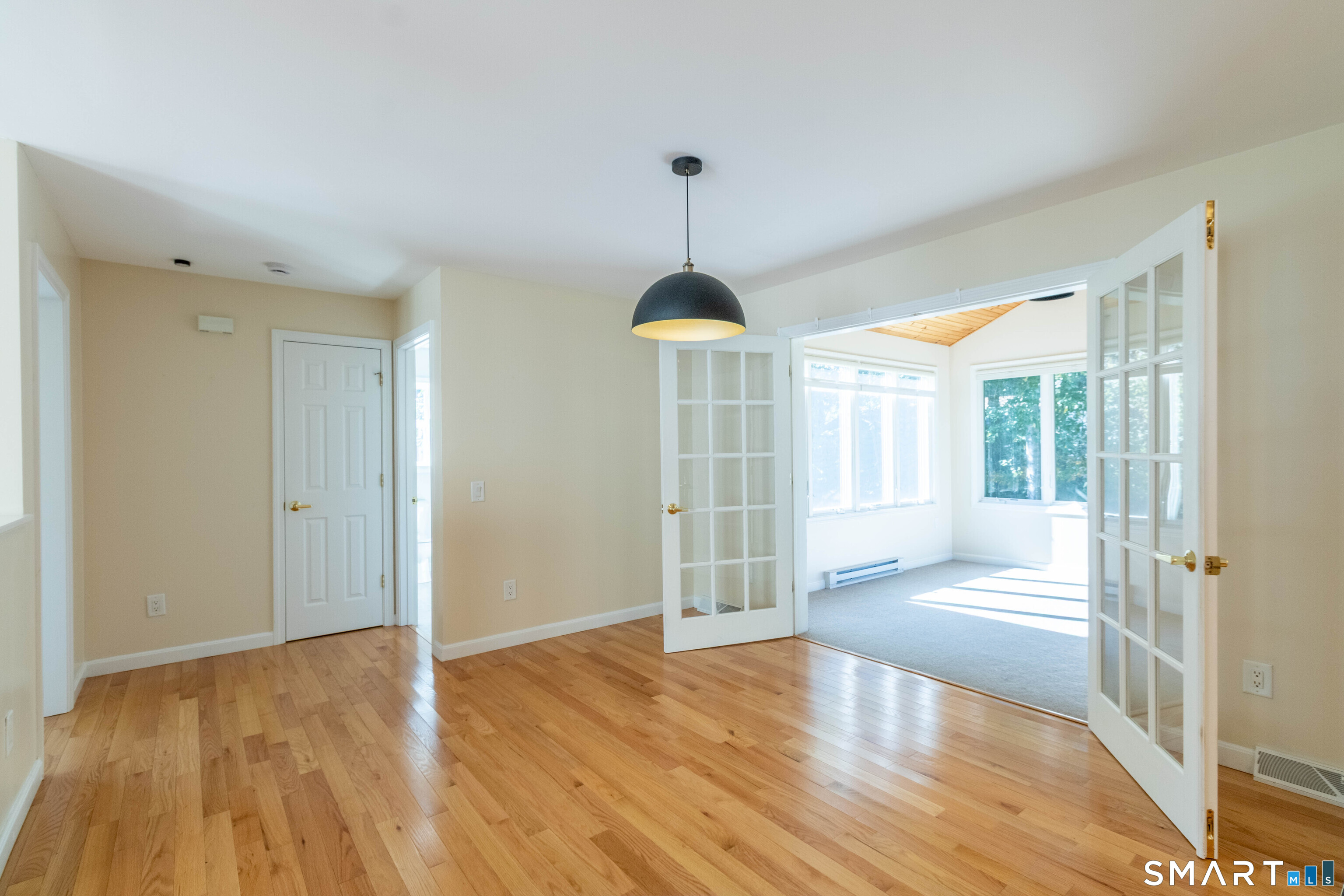 Dining area with French doors to sunroom