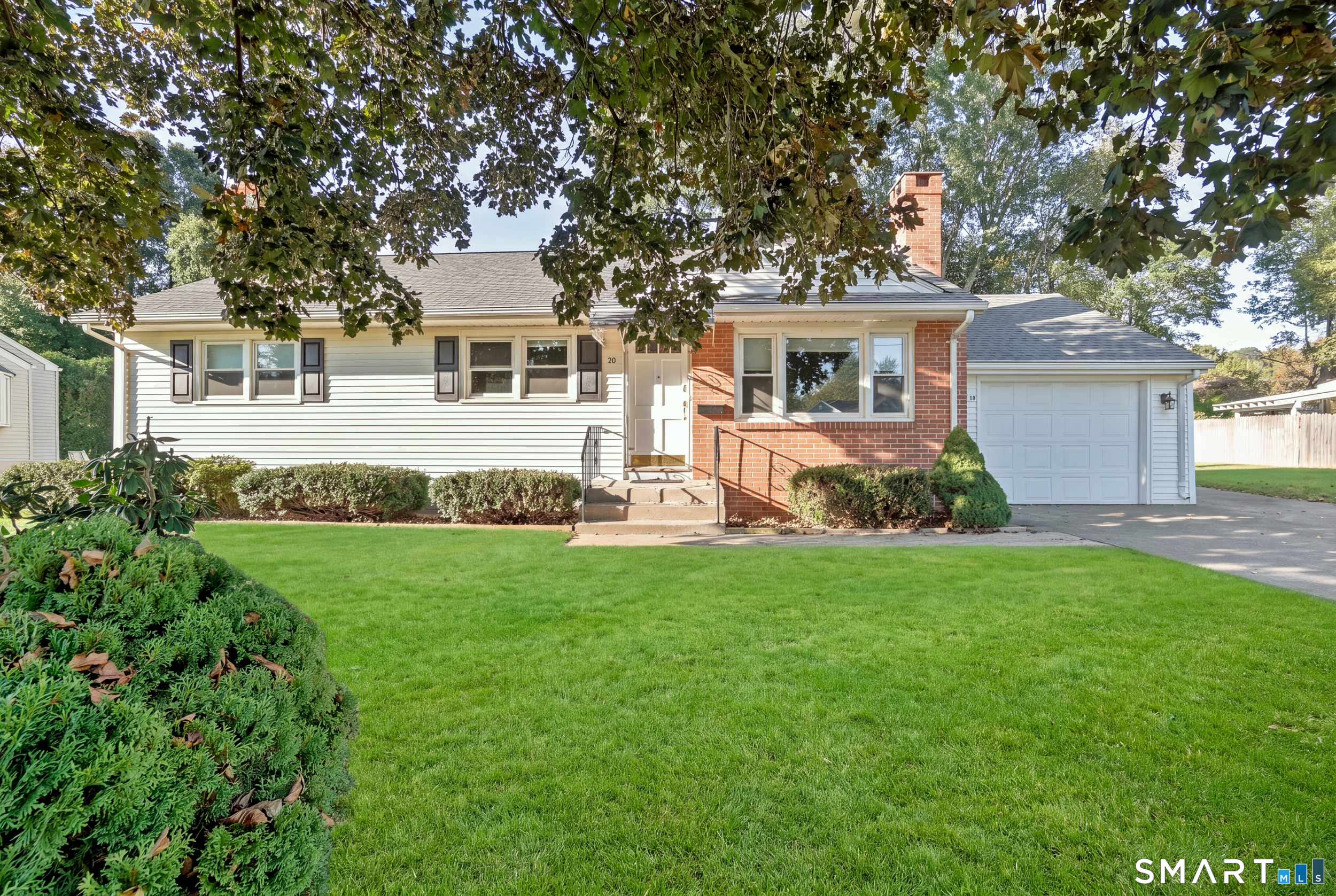 Welcome to 50 Lydall Road, a classic Newington ranch where timeless character, comfortable one level living and plenty of potential come together. Hardwood floors flow through much of the main level, beginning in the bright living room where a fireplace creates a warm focal point. The adjoining dining area features charming built ins, while the kitchen offers granite counters, abundant cabinetry, a subway tile backsplash and convenient main level laundry. Three bedrooms and a full bath with a stall shower complete the main floor, along with a sunroom overlooking the backyard, perfect for morning coffee or a quiet place to unwind. Downstairs, the heated, partially finished lower level expands the possibilities with additional room and a cedar closet, while still leaving plenty of room for storage. Central air adds year round comfort, while a newer roof (five years old), adds another valuable update. An attached one car garage keeps everyday life easy. Outside, enjoy a level backyard with room to garden, play or entertain, plus a patio and storage shed. With public water and sewer, a paved driveway and a convenient location near parks, shopping, recreation and everyday amenities, this home offers the kind of solid foundation that makes it easy to imagine putting down roots and making it your own. A wonderful opportunity to bring your style, ideas and vision to a well loved home in the heart of Newington.