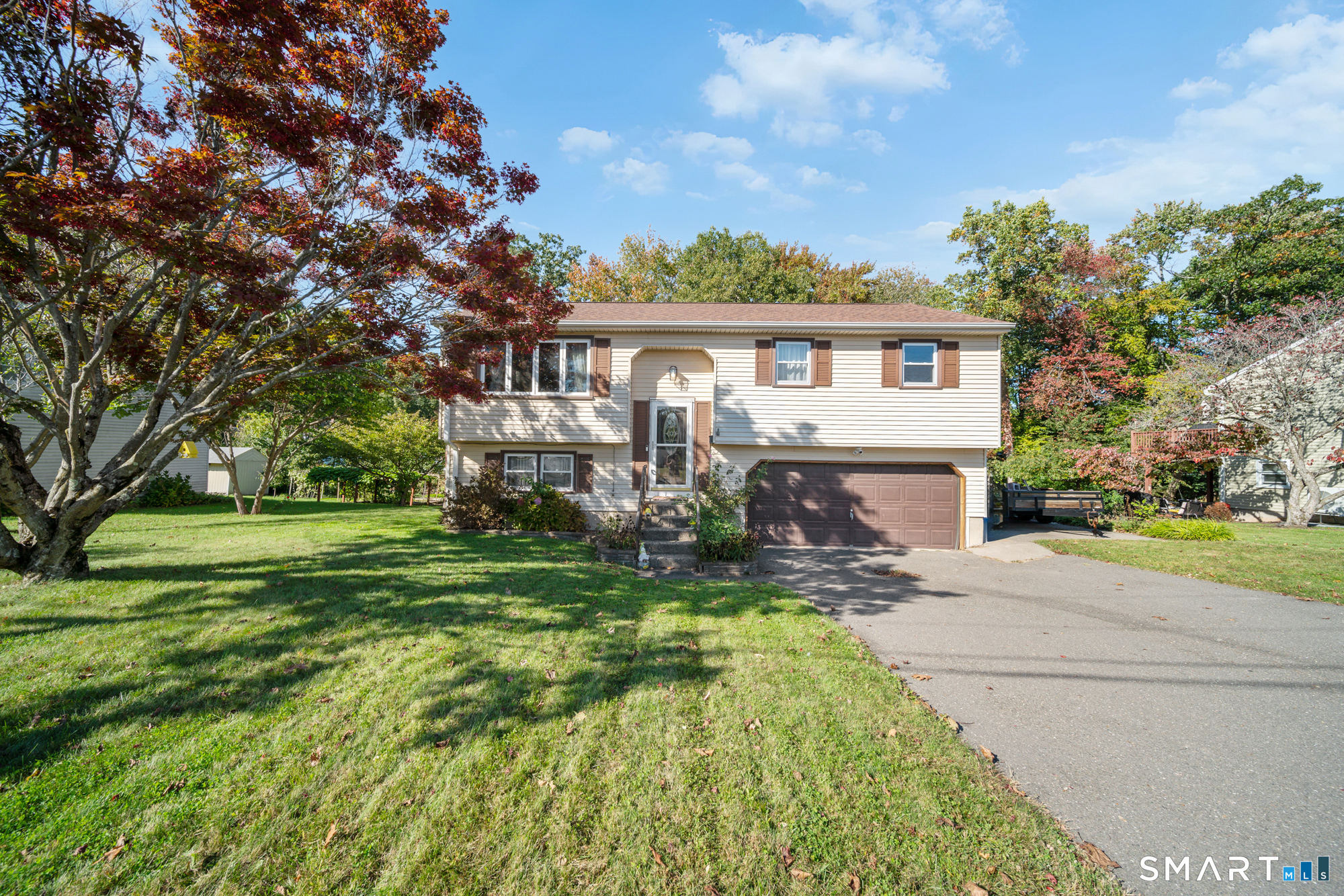 You'll feel right at home in this beautifully updated 3-bedroom, 1.5-bath home with so much to offer! Freshly painted interiors, gleaming hardwood floors throughout the main level, and a warm, inviting kitchen create a welcoming atmosphere. Updates include new bedroom closet doors, baseboards, thermostats, and fixtures, making this home ready for you to move right in. Enjoy relaxing or entertaining on the upper-level Trex deck or lower-level concrete patio. An efficient pellet stove can serve as the home's primary heat source, helping reduce heating costs. Full of warmth and charm, this move-in-ready home is one you'll be excited to call your own. Book your private showing today!