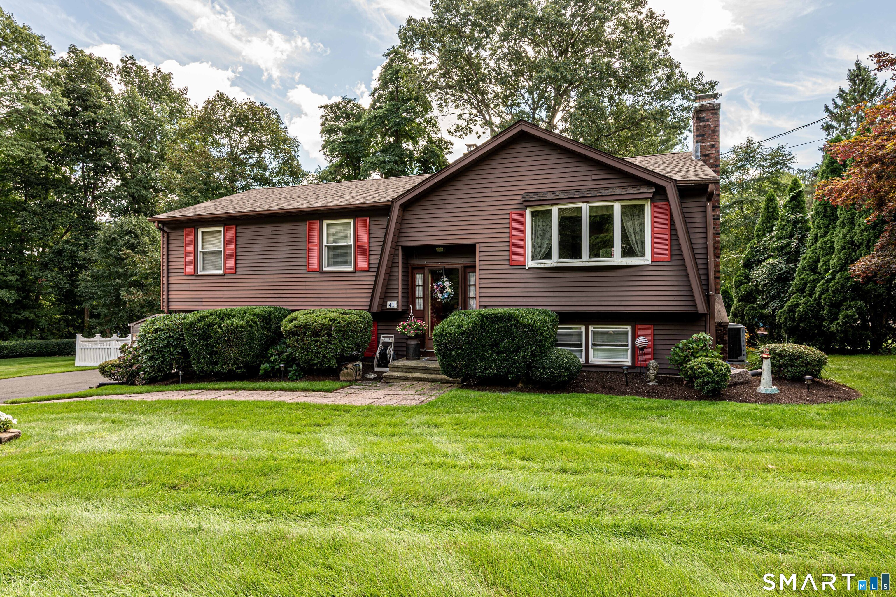 Thoughtfully maintained 3-bedroom, 2.5-bath Raised Ranch ideally situated on a cul-de-sac street. The spacious eat-in kitchen features abundant cabinetry, a built-in island, and generous workspace, making it well suited for both everyday living and entertaining. The primary bedroom offers the convenience of a private bath, while two additional bedrooms provide comfortable and flexible living options. The inviting lower-level family room, complete with a fireplace, adds valuable living space for relaxing, working from home, or hosting guests. Outside, enjoy the expansive double-deck overlooking the backyard and above-ground pool, creating an ideal setting for outdoor dining, entertaining, or simply unwinding. Additional highlights include central air conditioning and important updates, including a newer roof, plus a furnace and oil tank that are approx. three years old. Conveniently located near Sleeping Giant State Park, the Farmington Canal Heritage Trail, and Quinnipiac University, this home offers easy access to outdoor recreation, local amenities, and commuter routes. With its versatile floor plan, well-maintained systems, and desirable cul-de-sac setting, this is a wonderful opportunity to enjoy comfortable living in a sought-after location.