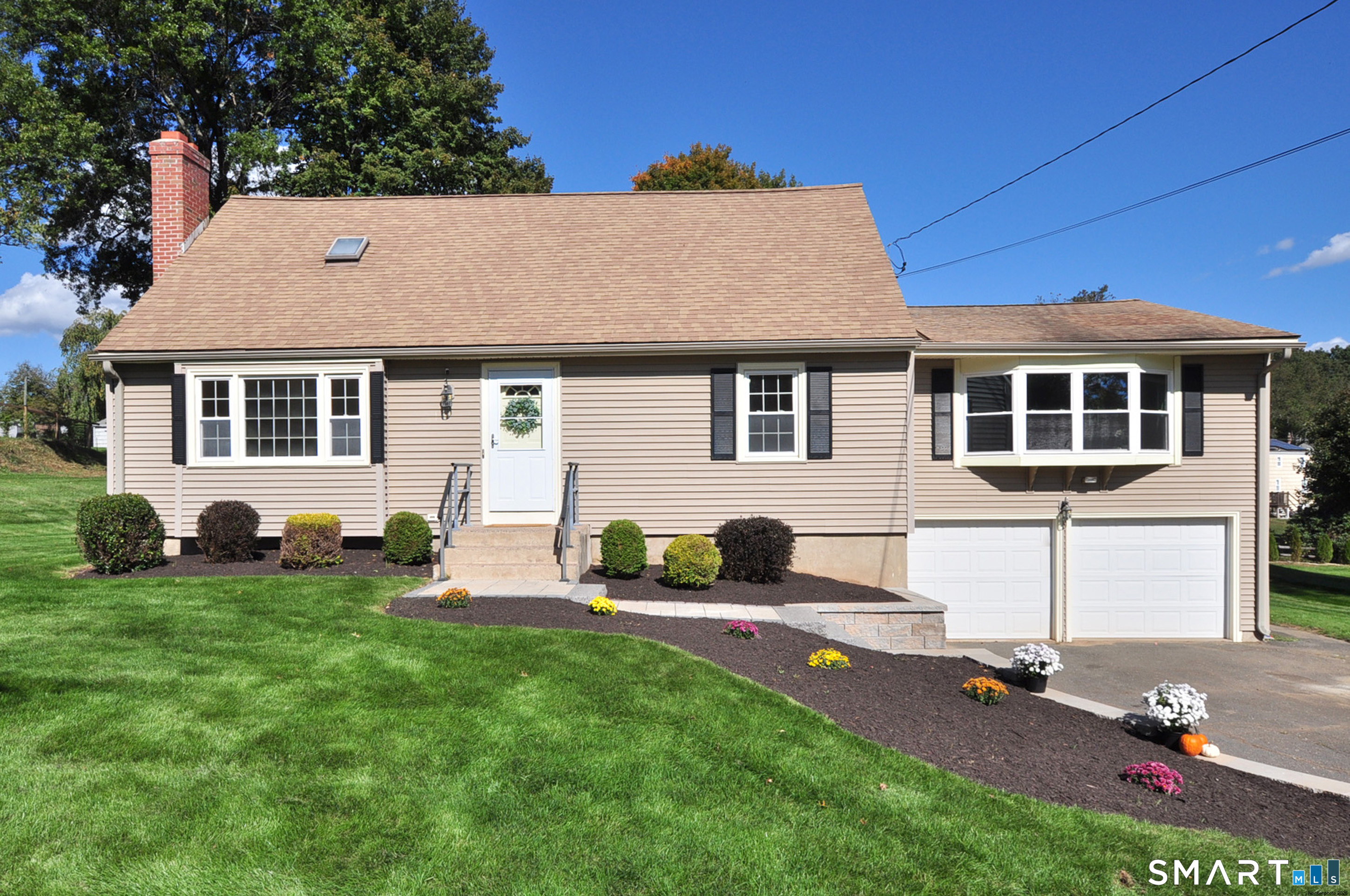 Rarely found in the sought-after "Spices" neighborhood! Located on a quiet cul-de-sac, this 3 bedroom, 2 bathroom Cape Cod is move-in ready. The rolling green lawn and new retaining wall with granite steps (2024) create a welcoming first impression. The spacious living room has classic New England charm with gleaming hardwood floors and a cozy fireplace. The kitchen has been outfitted with new GE appliances (2026) and flows into the dining room and light-filled family room. Vaulted ceilings, exposed beams, and newer windows (2017) create an airy, inviting space in the family room. Doors from both the kitchen and family room open to the patio overlooking the backyard-perfect for entertaining or relaxing. The first floor also features a convenient bedroom or office and a renovated full bathroom. Upstairs, there are three freshly painted bedrooms with new carpeting (2026), a renovated hallway bathroom with tub and shower and a linen closet. Additional highlights include refinished hardwood floors, new carpeting and paint, updated light fixtures, first-floor laundry, abundant storage in the unfinished lower level, a two-car garage, new leach fields and septic tank(2009). This home offers comfort, functionality and a highly desirable location. Enjoy close proximity to schools, restaurants and parks, with easy access to Routes 20 and 91. Schedule your private showing today!