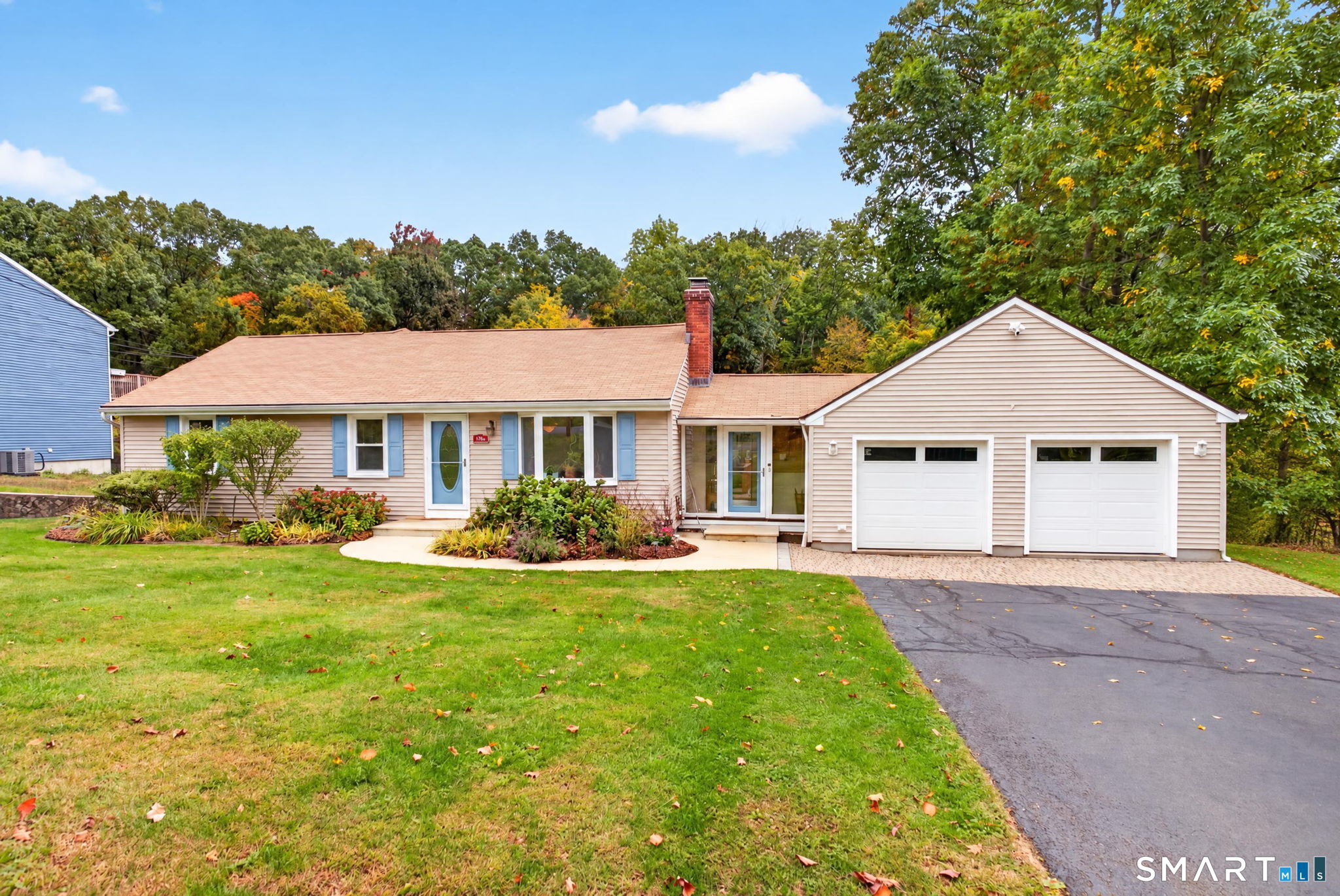 Welcome to this stunning oversized ranch that truly has it all! This spacious four-bedroom, two-and-a-half-bathroom home offers a fantastic layout with plenty of room for everyday living and entertaining. The main level features a welcoming living room, kitchen, and dining room, along with three generously sized bedrooms and a full bathroom. Tucked away at the back of the home is a gorgeous primary bedroom addition that serves as your own private retreat! This impressive space features vaulted ceilings, a walk-in closet, and a private full bathroom. Just off the primary bedroom is a beautiful heated sunroom, which can also be accessed directly from the deck, making it the perfect spot to relax year-round! Heading downstairs, you'll find a spacious, partially finished lower level offering endless possibilities! This area features a propane fireplace, wet bar, and plenty of room for entertaining. Additional rooms provide flexibility for a home gym, office, playroom, or whatever suits your needs. You'll also find ample storage space and a convenient half bathroom on this level. Now, let's talk about the exterior because this backyard is truly an entertainer's dream! Situated on just under an acre of land, this property offers an incredible outdoor setup featuring a large Trex deck, outdoor bar, full basketball court, bocce court, and even a wood-burning pizza oven! Whether you're hosting summer gatherings, enjoying a game of basketball, or making homemade pizzas with family and