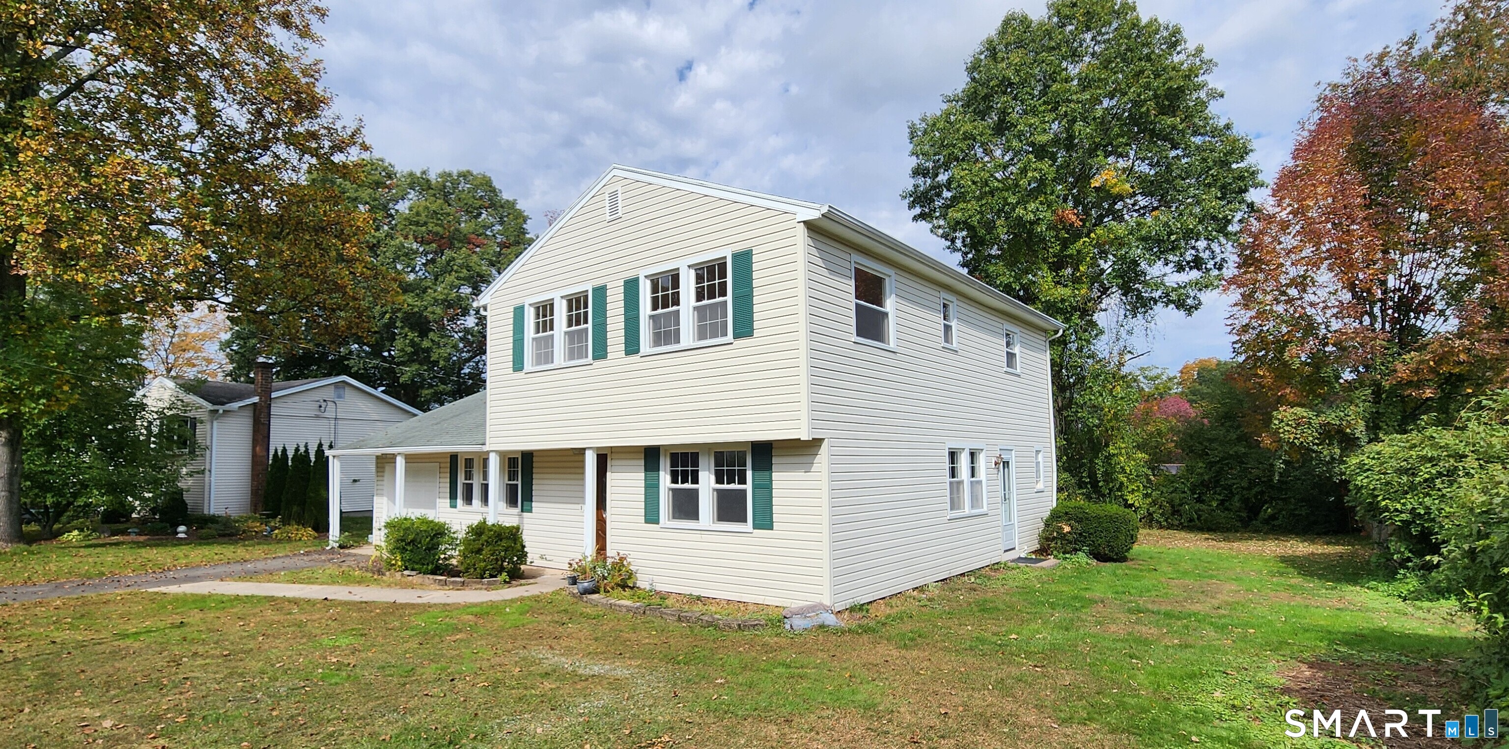 Welcome to 141 Flower Drive, Hamden! Beautifully remodeled and move-in ready, this charming 3-bedroom, 2-full-bath Colonial offers the perfect blend of warmth, style, and modern comfort. Sun-drenched living spaces include a welcoming living room, inviting family room, and dining room just off the kitchen, plus a convenient first-floor full bath. Upstairs, discover a spacious primary bedroom, two generously sized additional bedrooms, and an updated full bath with a tiled tub and shower. Enjoy added peace of mind with energy-efficient vinyl replacement windows, a Navien on-demand heating system, and an architectural shingle roof. A level yard and one-car garage complete the package. Ideally situated bordering Hamden's beautiful Mount Carmel section, close to Quinnipiac University, Sleeping Giant State Park, the Farmington Canal Trail, shopping, and major commuter routes. Turn the key and discover the comfort of home!