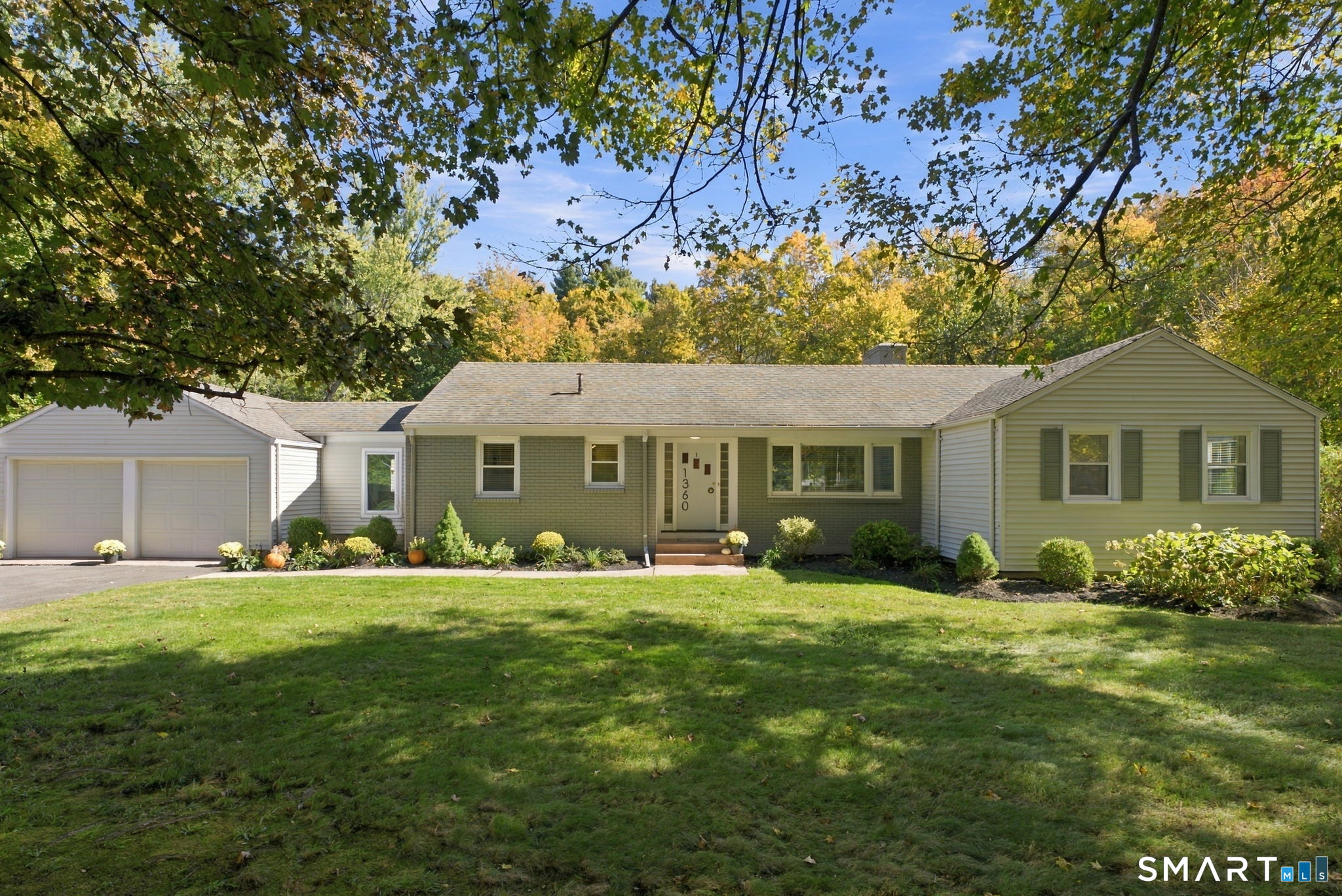 Welcome to 1360 Main Street, Glastonbury. This 9 room meticulously maintained home has been owned by the same family for over four decades. The 2,215 square foot ranch style home features 4 bedrooms and 2 1/2 bathrooms. The home sits on an impressive 2.76-acre lot with mature trees and terraced patios for outdoor entertaining. Between the outdoor living space and with gleaming hardwood flooring and 2 wood burning fireplaces inside this is definitely an ideal entertaining property. Continuing to the lower which is finished and offers a fireplace, full bathroom, your 4th bedroom, a wet bar and a walk out to your large backyard. The home has recently been updated with a brand new furnace, central air conditioning, custom blinds and fresh paint.