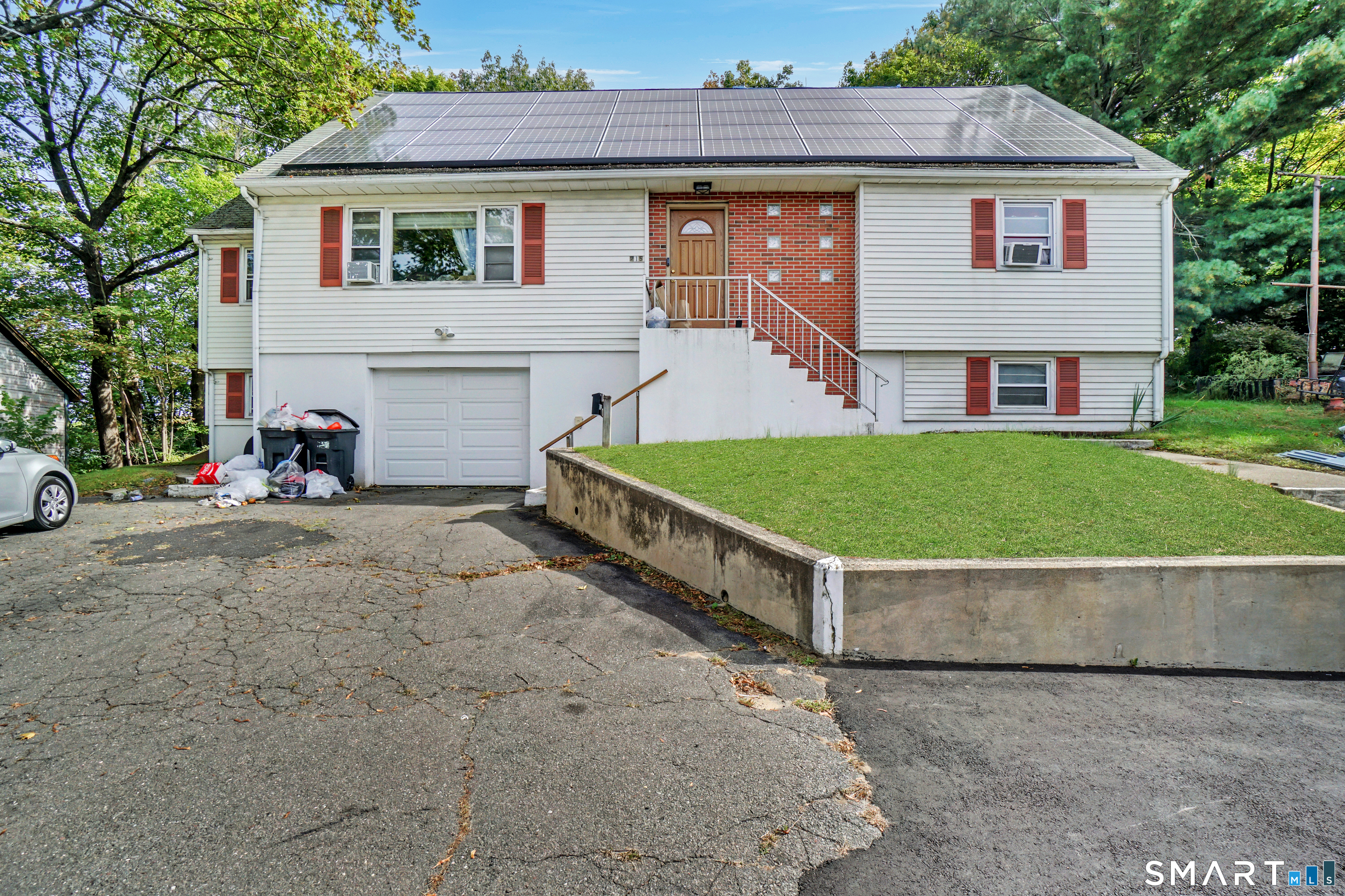 Welcome to 215 Hawkins Street! This spacious 4-bedroom, 2.5-bath Cape offers approximately 2,640 square feet of living space with plenty of room and possibilities. The home is ready for updating and improvements, making it a great opportunity for a buyer looking to create a space that reflects their own style and vision. With a generous layout, fireplace, attached garage, and plenty of potential, this property is ready for its next chapter. Bring your ideas and imagine what this home could become.