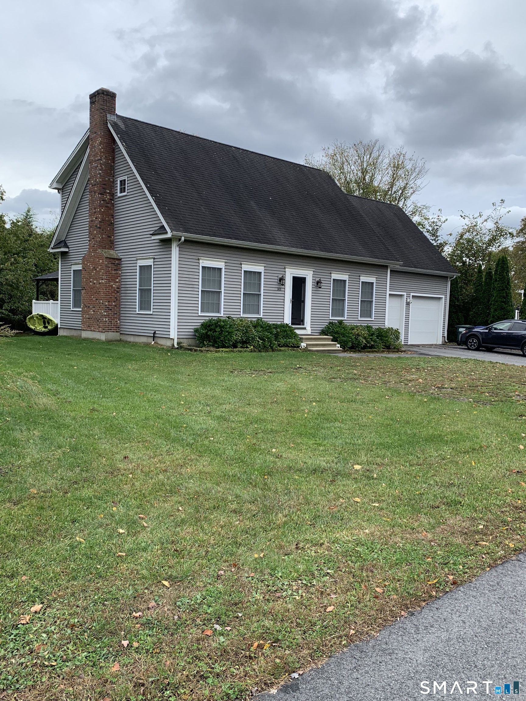 Located in the heart of Mystic, within the town of Stonington, CT. Features an open floor plan with high ceilings, a masonry fireplace 2-car garage and a spacious lot. Completed in 2007. Hardwood floors throughout, center island and granite countertops in the kitchen, primary suit with walk-in closets, and up stair's den/office space. Huge bedroom above the garage. New hot water tank 2025, driveway 2024, deck. Convenient to boating, beach and everywhere. Don't miss the opportunity.