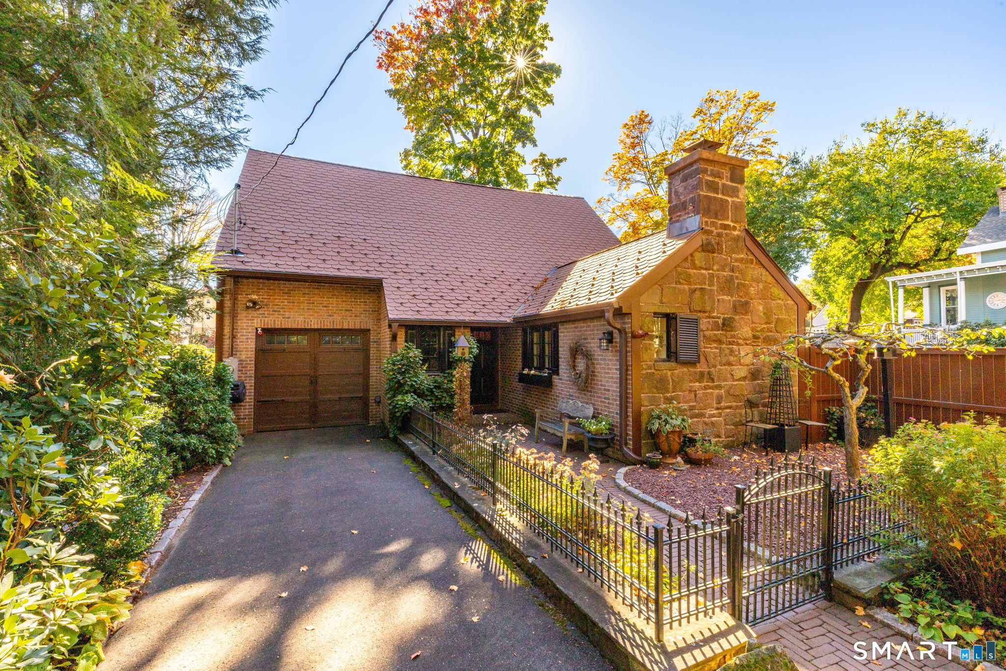 Welcome to this rarely available charming English cottage, which graced the pages of Architectural Digest. It's nestled in a desirable location and set back from the road to offer exceptional privacy and tranquility. Rich in character and thoughtfully designed-this delightful two bedroom, two bath home reflects the vision of its noted interior designer owner-who has made the most of every square inch with no expense spared, and an eye for detail and timeless style. The tastefully remodeled kitchen blends beauty and functionality-featuring custom made cabinets, hand made tiles from England and stainless steel appliances just two years young. The fireplaced living room with vaulted ceiling adds wonderful drama. In addition the first floor den/office could be a third bedroom. Additional highlights are as follows; a lovely versatile room including wine cooler and sink which comes in handy when hosting guests- a sleek EcoStar tiled roof, only four years old-an attached one car garage-first floor laundry and private grounds offering a peaceful retreat for relaxing or entertaining. Full of charm and carefully curated touches-this one of a kind inviting cottage offers a wonderful blend of character, comfort and thoughtful design. Truly a must see!!!