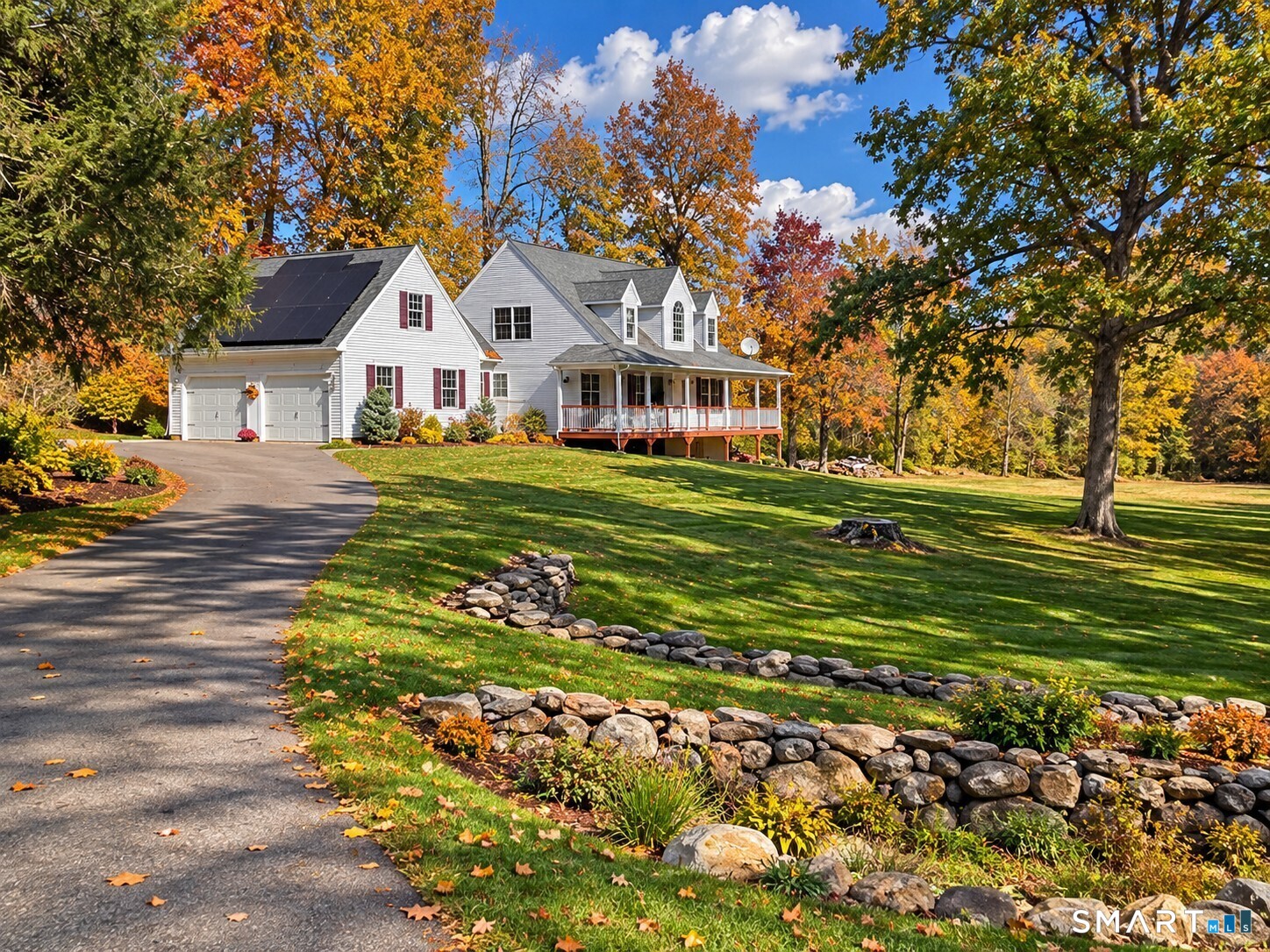 ESCAPE THE ORDINARY AT 18 LUCKS WAY! A PRIVATE 4-ACRE COUNTRY RETREAT! Discover a rare blend of privacy, beauty, and timeless charm in this Custom-Built, Original-Owner Home nestled in the picturesque countryside of Bolton! A winding private driveway welcomes you to 4 serene acres surrounded by mature trees, beautiful stone walls, colorful perennial gardens, and breathtaking views of a neighboring horse farm. Imagine relaxing on your sweeping wraparound porch, enjoying peaceful mornings, spectacular fall foliage, and the tranquility of nature! Step inside to an impressive open-concept design featuring soaring vaulted ceilings, sun-filled living spaces, and a dramatic second-floor balcony overlooking the main living area and 2 story foyer. An inviting floor to ceiling fieldstone Fireplace with stove insert creates the perfect gathering place, while the inviting Kitchen offers granite countertops, beautiful maple cabinetry, stainless steel appliances, and generous workspace along with large eat-in space surrounded by bright windows. Enjoy a formal Dining room for holiday dinners and a wonderful mudroom with large pantry and convenient first-floor Laundry, and an attached 2-Car Garage with unfinished, prewired space above-ideal for a future Bonus Room, Home Office, or 4th Bedroom. The expansive 9-foot walkout Basement with double-wide exterior doors offers even more possibilities for workshop space or storage! Quality 2x6 construction, 200-amp, generator hookup, forced-air heati