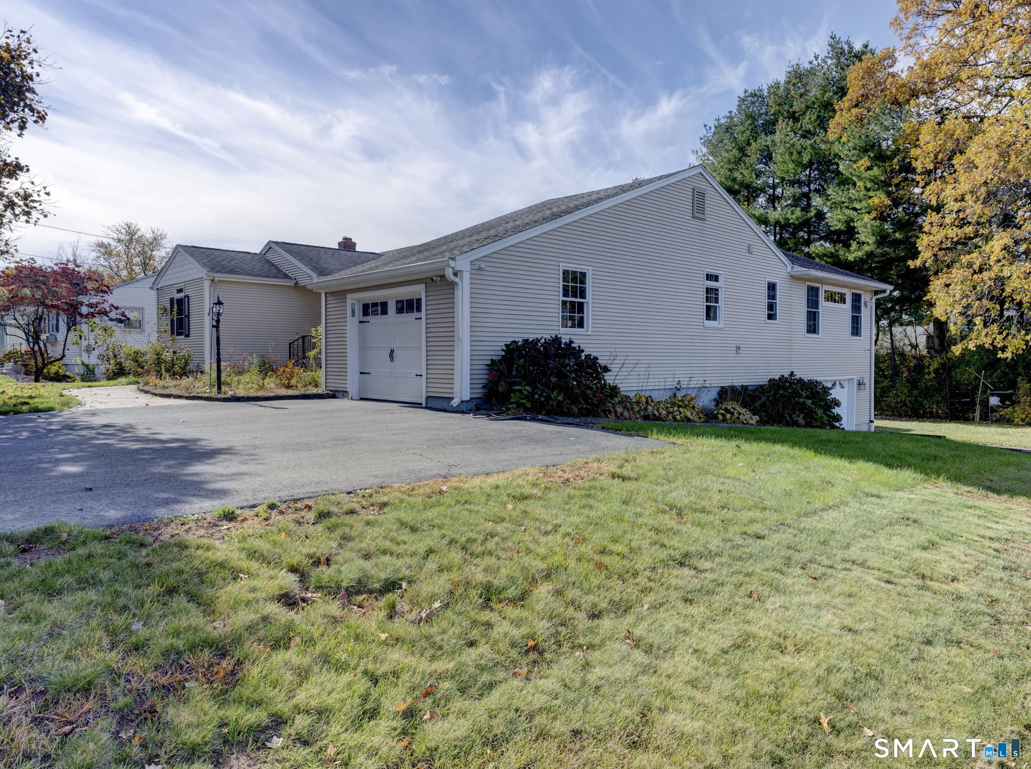 Welcome to 53 Harold Street, Wethersfield! This move-in-ready 4-bedroom, 3-bath home offers a versatile layout with plenty of space for today's lifestyle. The main level features an open-concept floor plan where the kitchen flows seamlessly into the living room, creating the perfect setting for everyday living and entertaining. Adjacent to the kitchen is a dedicated dining area, ideal for family meals and gatherings. Step outside from the living room onto a beautifully appointed deck featuring low-maintenance AstroTurf and a gazebo, providing the perfect outdoor retreat for relaxing, entertaining, or enjoying your morning coffee. The main floor also includes a spacious primary suite with a private bath, three additional bedrooms, a second full bath, and a convenient laundry room, allowing for comfortable one-level living. The finished lower level offers endless possibilities with a second kitchen, additional living space, and two flexible rooms ideal for guests, a home office, gym, or potential in-law setup. Direct access to the garages adds convenience and functionality. Car enthusiasts can appreciate the attached two-car garage, providing ample space for vehicles, storage, or workshop needs. Conveniently located in one of Wethersfield's desirable neighborhoods, this home combines comfort, flexibility, and exceptional value. A must-see property!