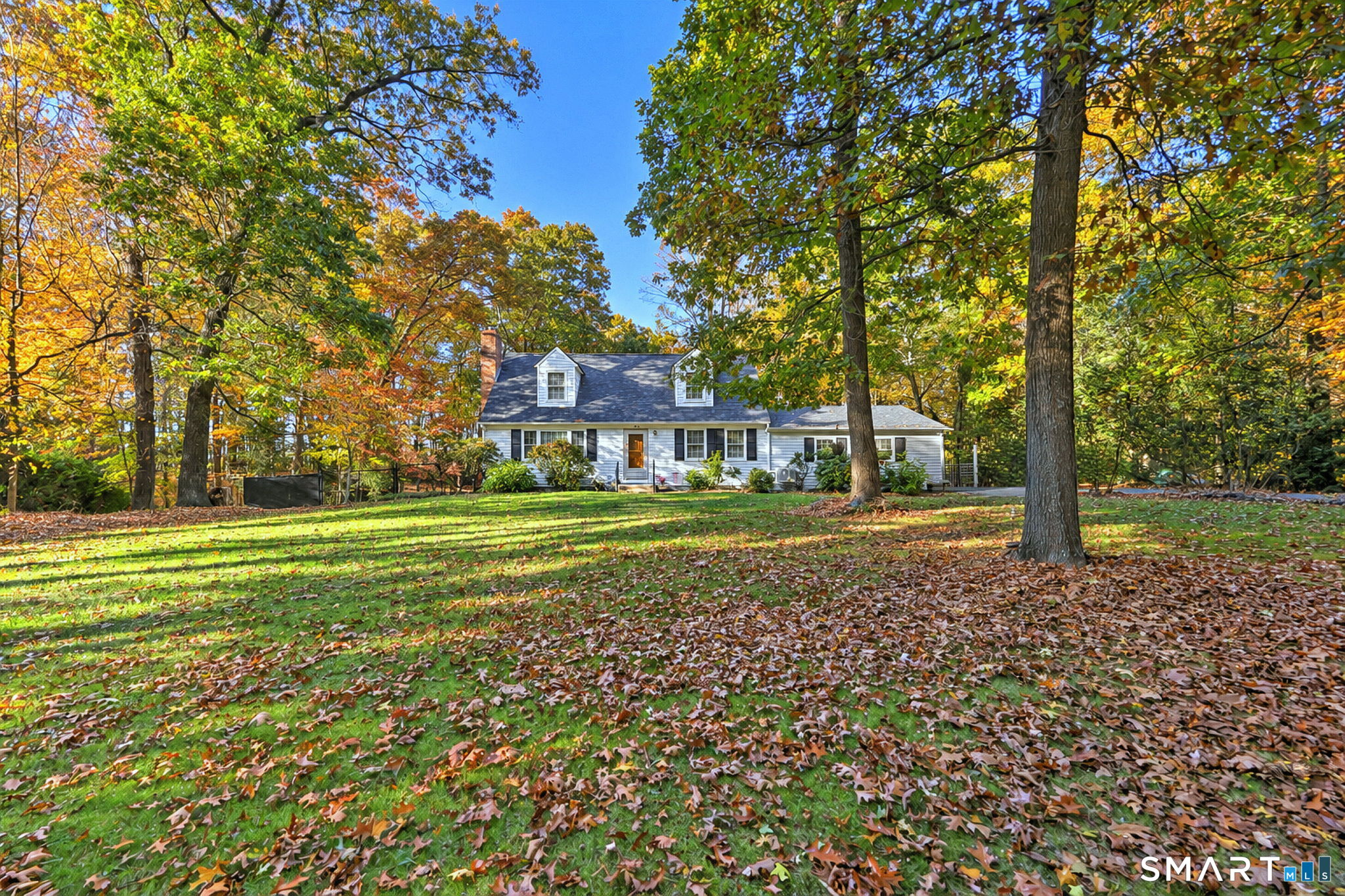 Nestled on a private, fenced .94-acre lot in one of Southbury's desirable neighborhoods,this beautifully updated New England Cape offers warmth, character, and thoughtfully designed living spaces throughout.The main level features a spacious living room centered around a cozy pellet stove, creating a warm and welcoming gathering space.The updated kitchen offers quartz countertops, center island, and newer appliances. A spacious dining room provides the perfect setting for gatherings and everyday meals. A generously sized first-floor bedroom and full bath complete the main level. The mudroom with laundry area offers easy access from the garage and the rear deck.The upper level features two large bedrooms, each with walk-in closets, additional storage areas, and a Jack-and-Jill bath, providing both privacy and functionality.The finished walk-out lower level offers exceptional versatility with a full bath, second laundry area, abundant storage, with french door leading to the backyard patio. Ideal as a family room, recreation room, guest suite, fitness area, or hobby space, this flexible level offers endless possibilities. Additional features include a new roof, new doors and window treatments, hickory laminate wood flooring, and energy-efficient mini-split systems providing both heat and central air. The fenced backyard offers privacy and plenty of room for pets, gardening, play, or simply relaxing outdoors.