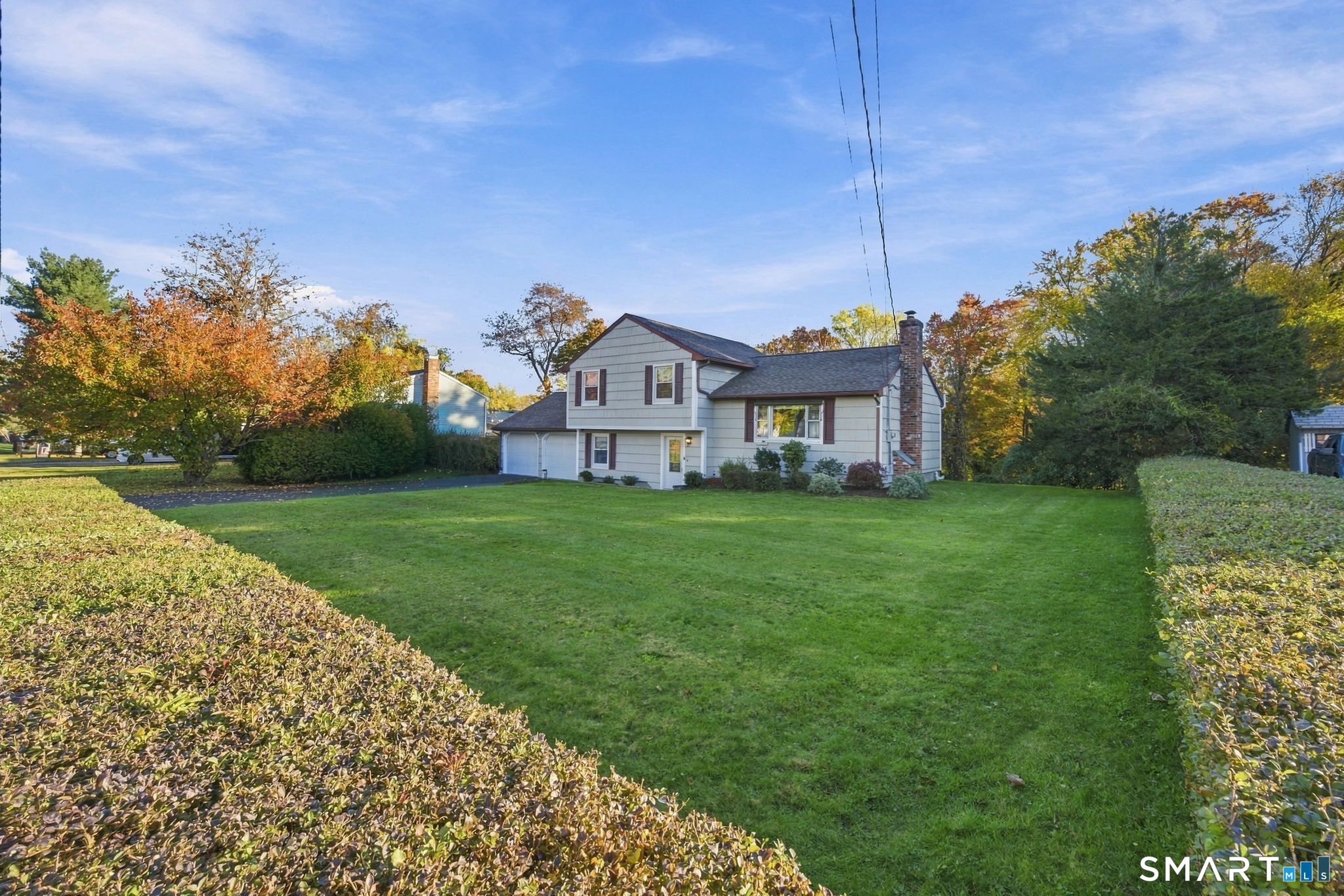 Welcome to this inviting three-bedroom, One and a half bath home set on a quiet street in a fantastic Wallingford location. From the moment you step through the door, you will appreciate the care that has gone into maintaining this property. The main level boasts a spacious living room with hardwood floors and an updated kitchen with custom-built cabinets, stainless steel appliances, tile backsplash and tile flooring. Upstairs you will find 3 bedrooms, 2 with new carpet and an updated full bathroom. A few steps down and there is a large family room with built in cabinets and newer carpeting. There is also a finished room in the lower level that can serve as a 4th bedroom, office, or guest space. Spend time on your large private deck overlooking a partially fenced in yard. Enjoy low electricity costs with Wallingford Electric! A rare opportunity to own a move-in-ready home in one of Connecticut's most desirable towns.